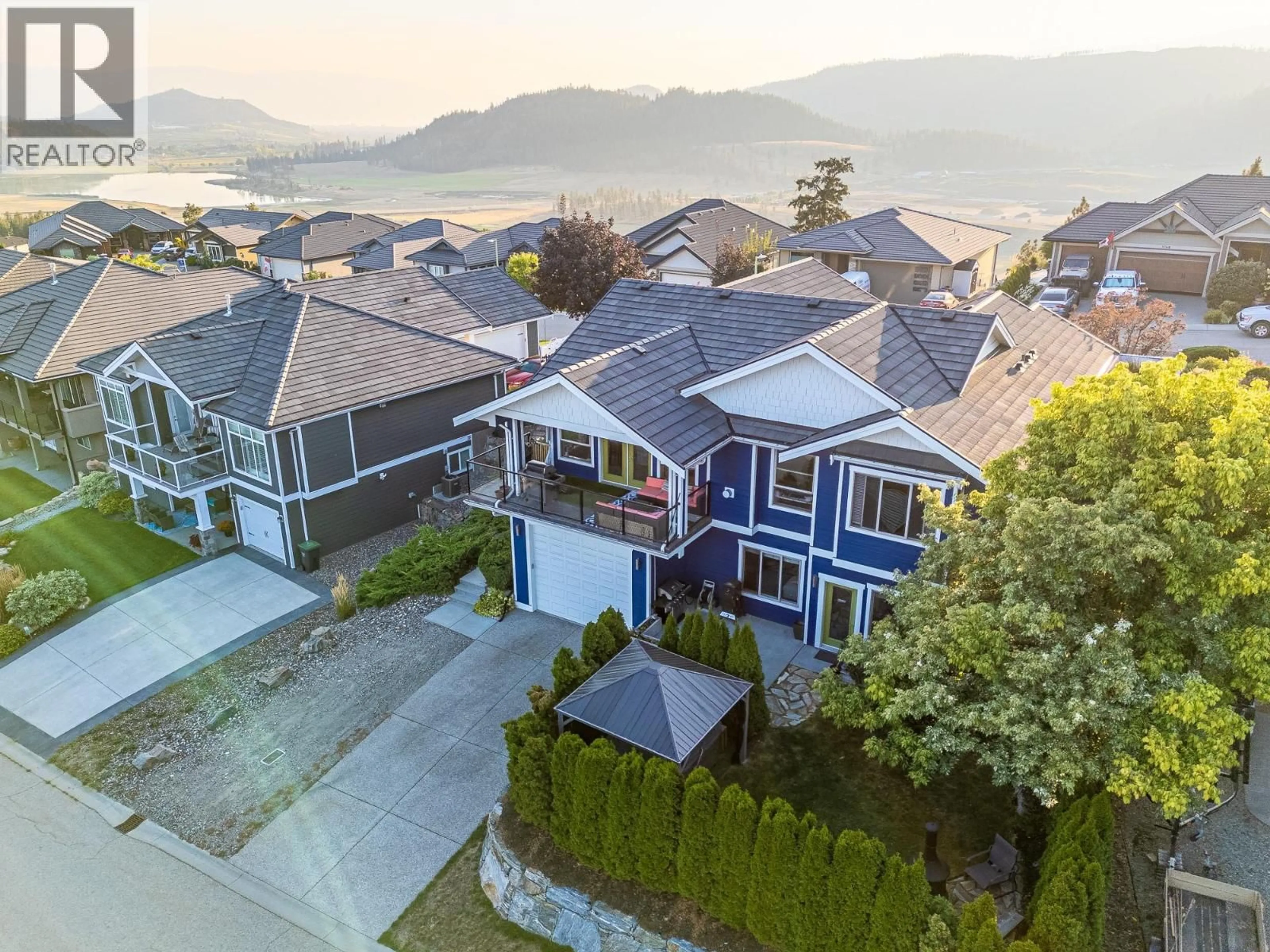A pic from outside/outdoor area/front of a property/back of a property/a pic from drone, mountain view for 1767 CAPISTRANO PEAKS CRESCENT, Kelowna British Columbia V1V2N1