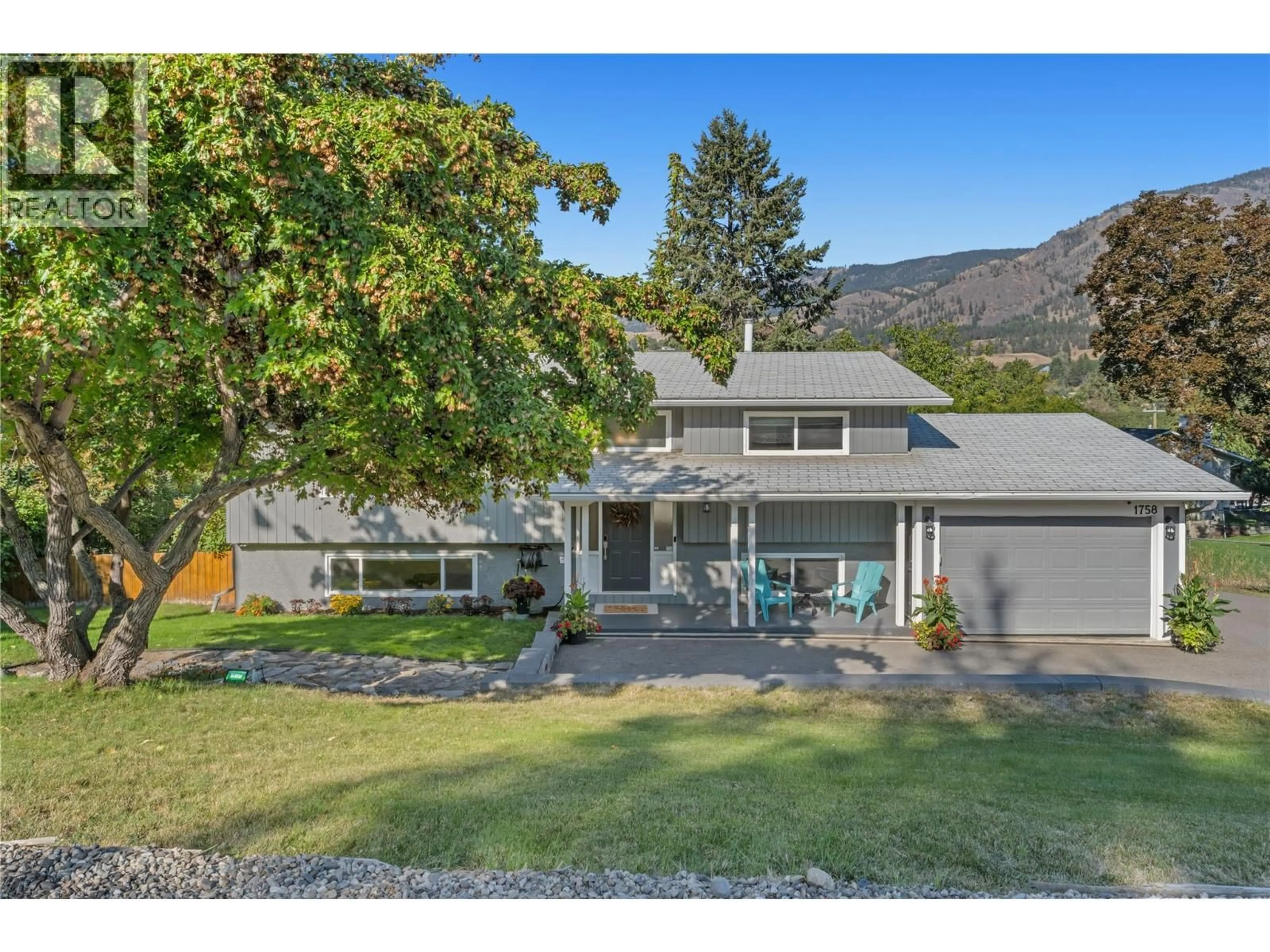 A pic from outside/outdoor area/front of a property/back of a property/a pic from drone, mountain view for 1758 SUNRISE ROAD, Kelowna British Columbia V1P1G3