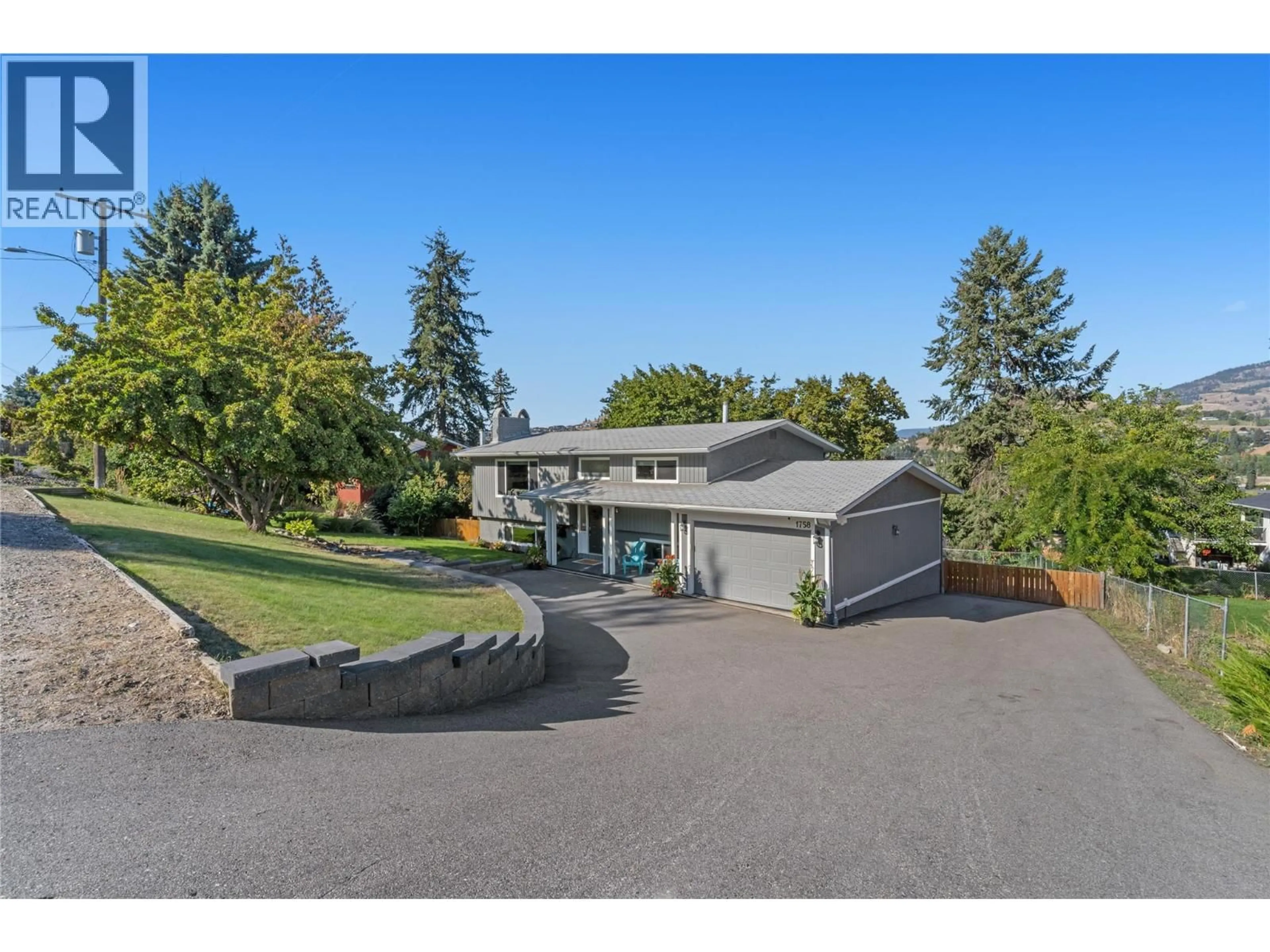 A pic from outside/outdoor area/front of a property/back of a property/a pic from drone, unknown for 1758 SUNRISE ROAD, Kelowna British Columbia V1P1G3