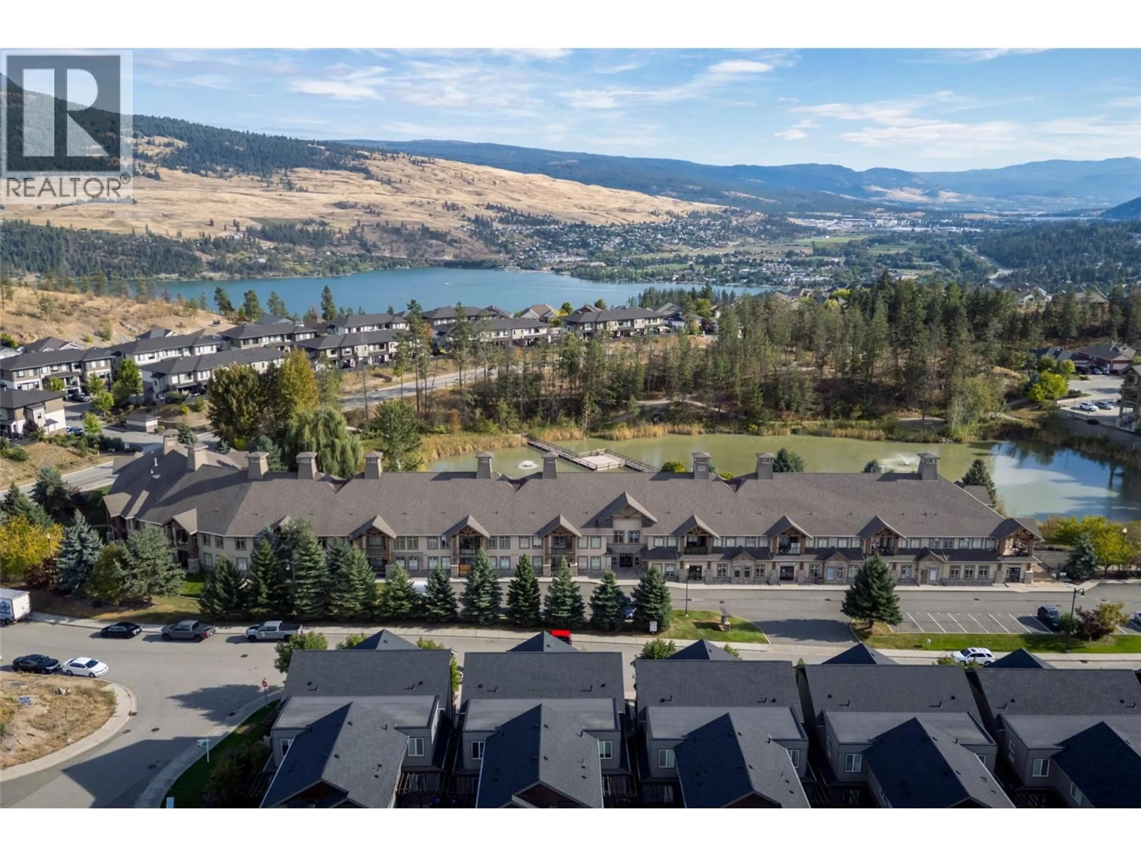 A pic from outside/outdoor area/front of a property/back of a property/a pic from drone, water/lake/river/ocean view for 109 - 2611 STILLWATER WAY, Lake Country British Columbia V4V2R3