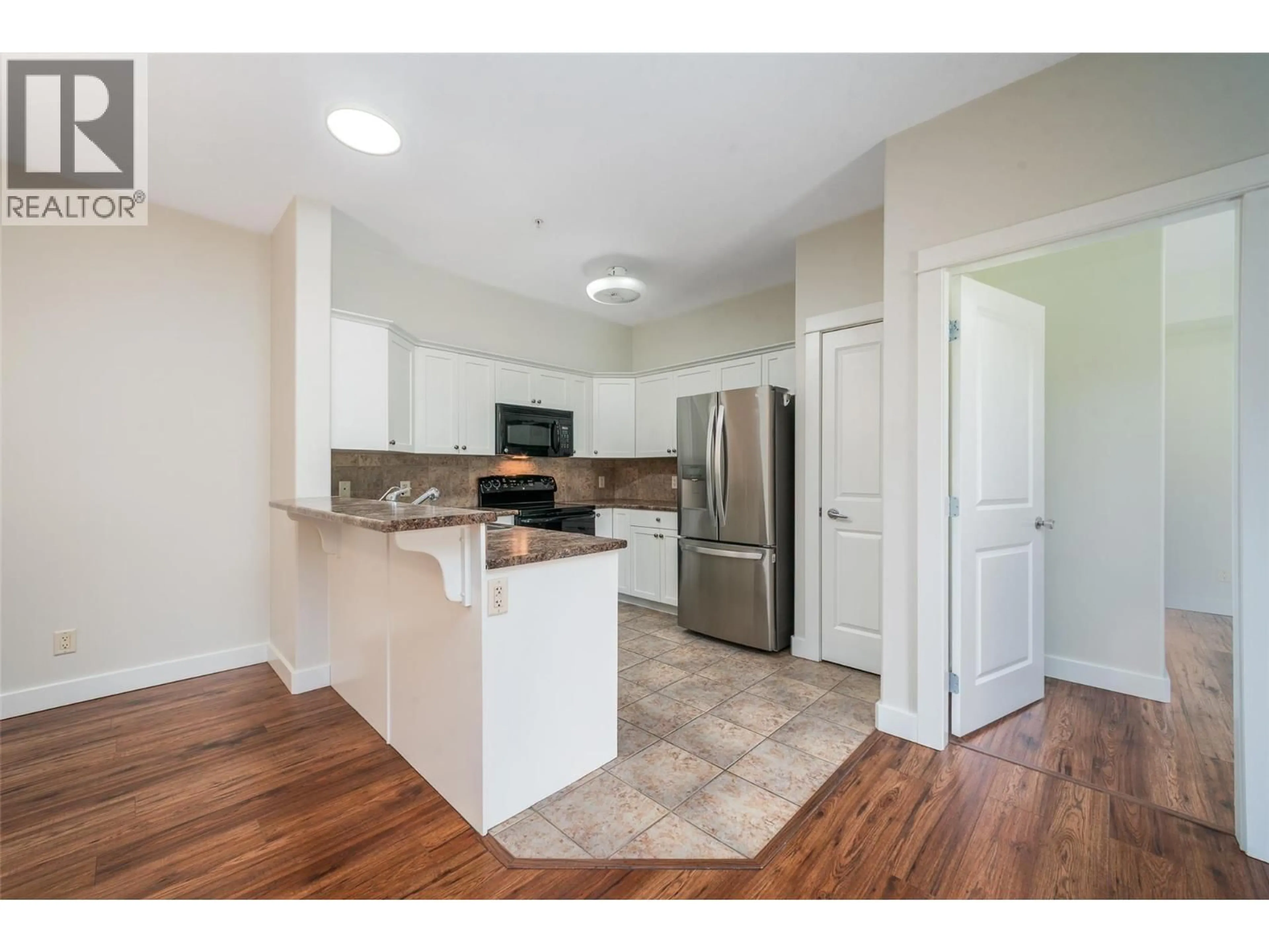 Open concept kitchen, unknown for 109 - 2611 STILLWATER WAY, Lake Country British Columbia V4V2R3