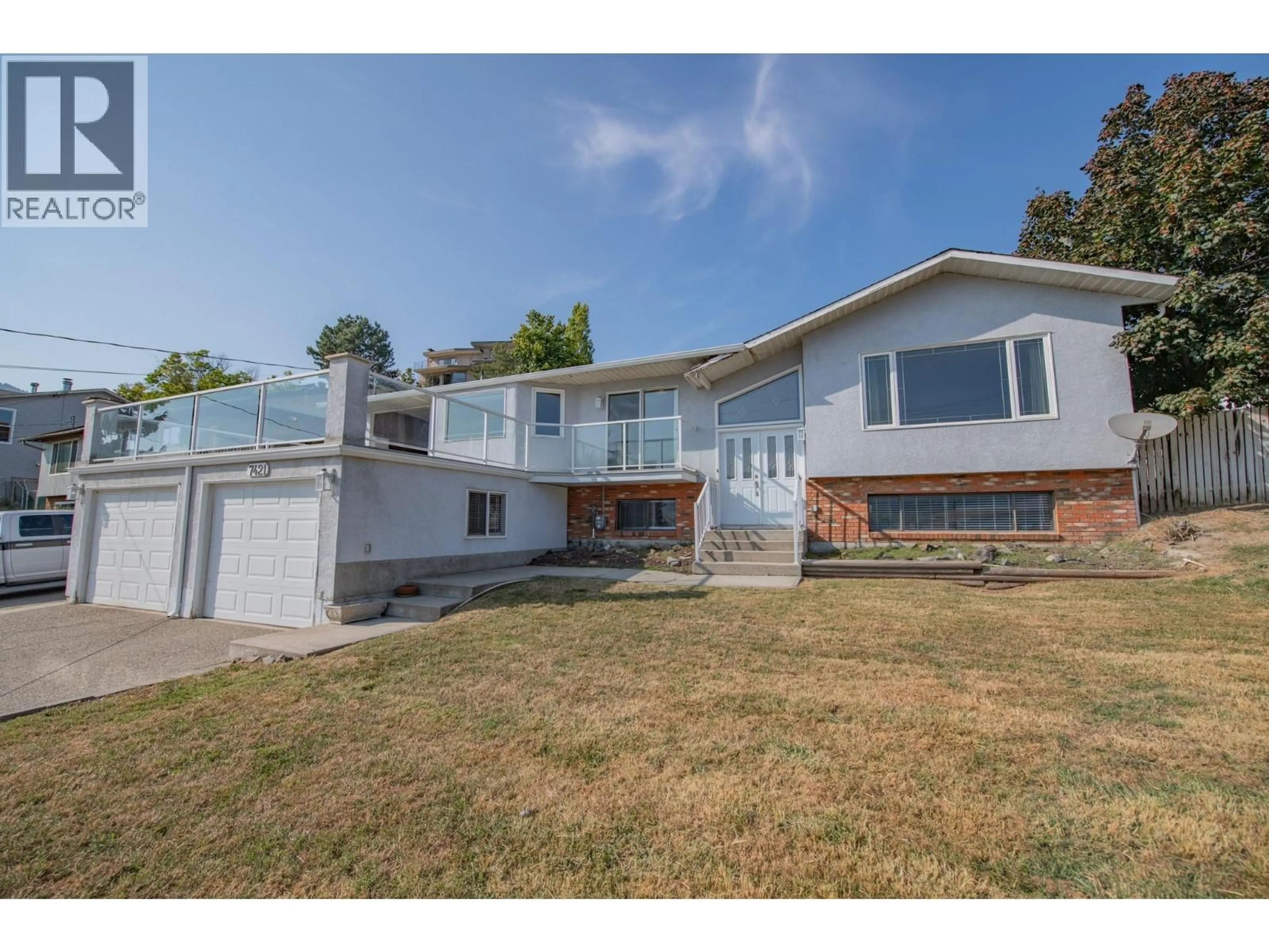Home with vinyl exterior material, street for 7421 TRONSON ROAD, Vernon British Columbia V1H1S4