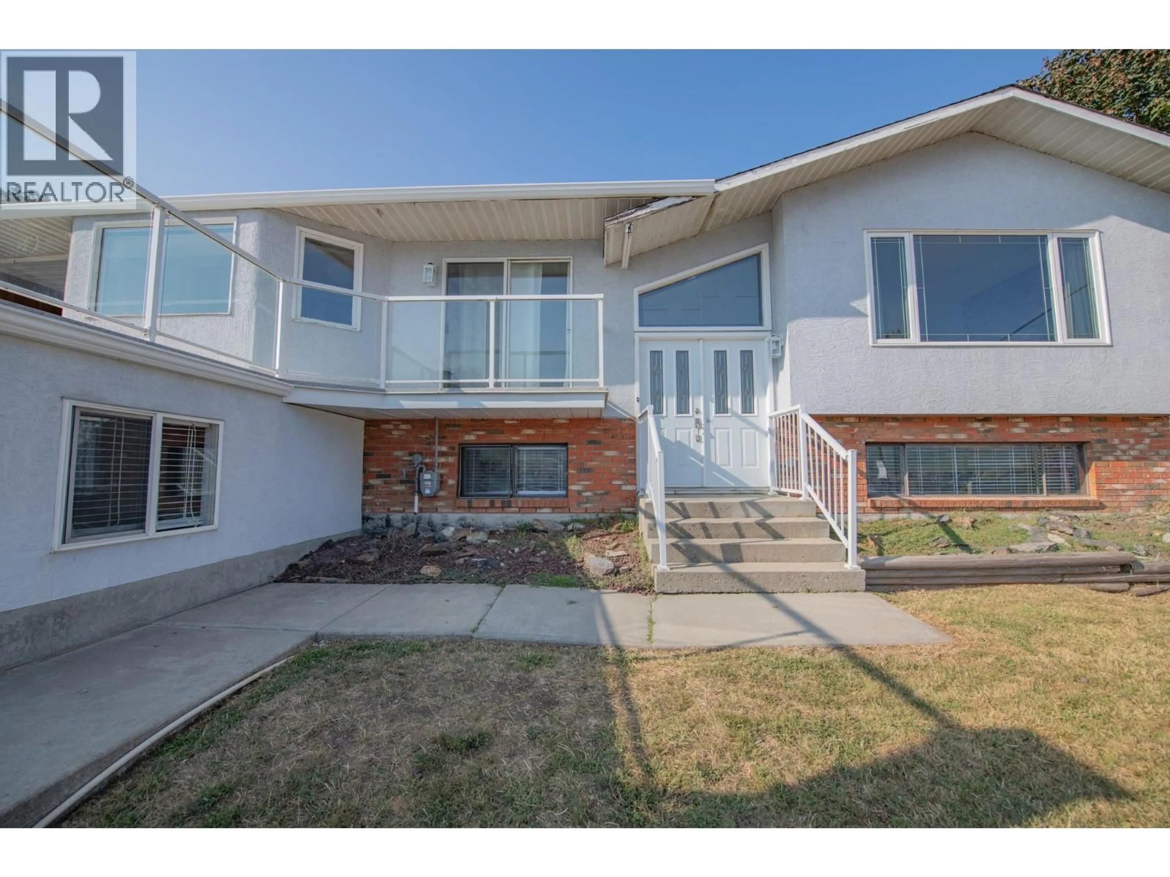 Home with vinyl exterior material, street for 7421 TRONSON ROAD, Vernon British Columbia V1H1S4