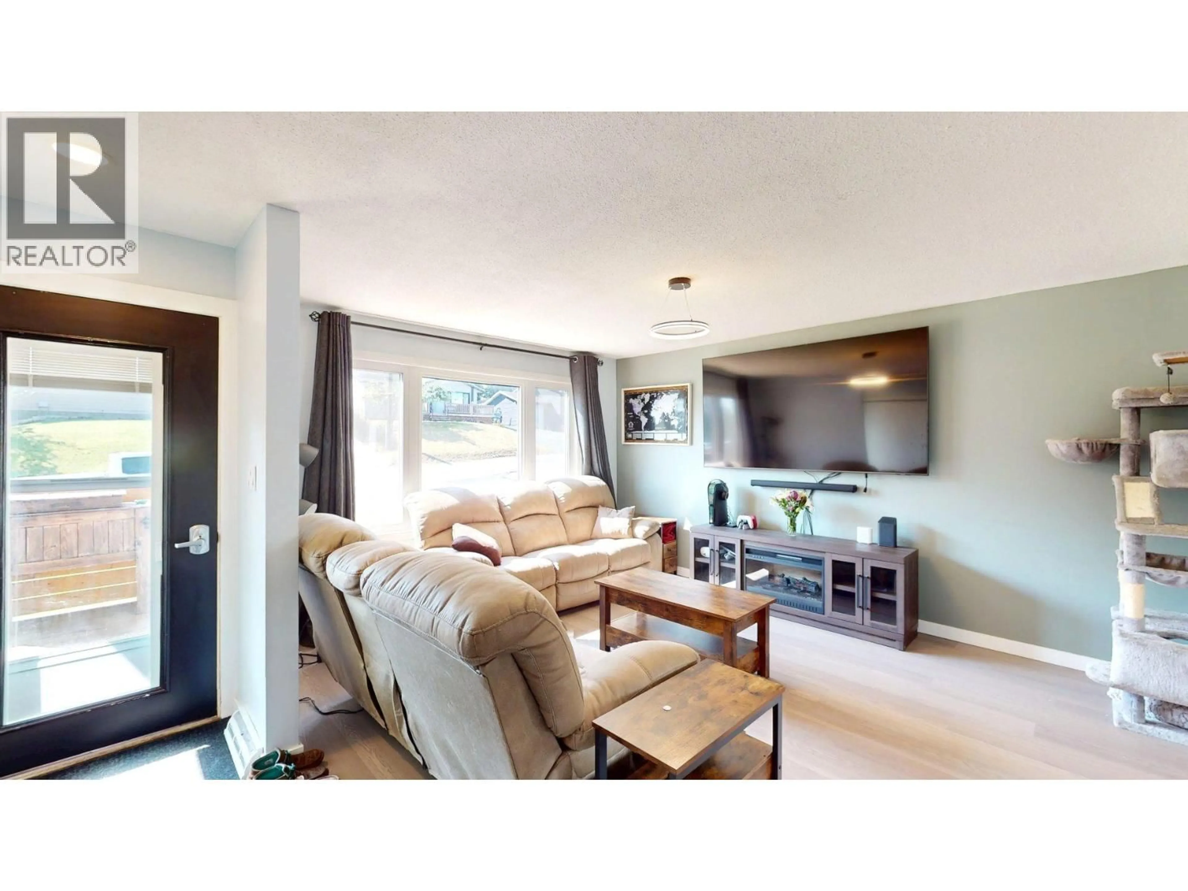 Living room with furniture, wood/laminate floor for 2201 ALMOND STREET, Elkford British Columbia V0B1H0