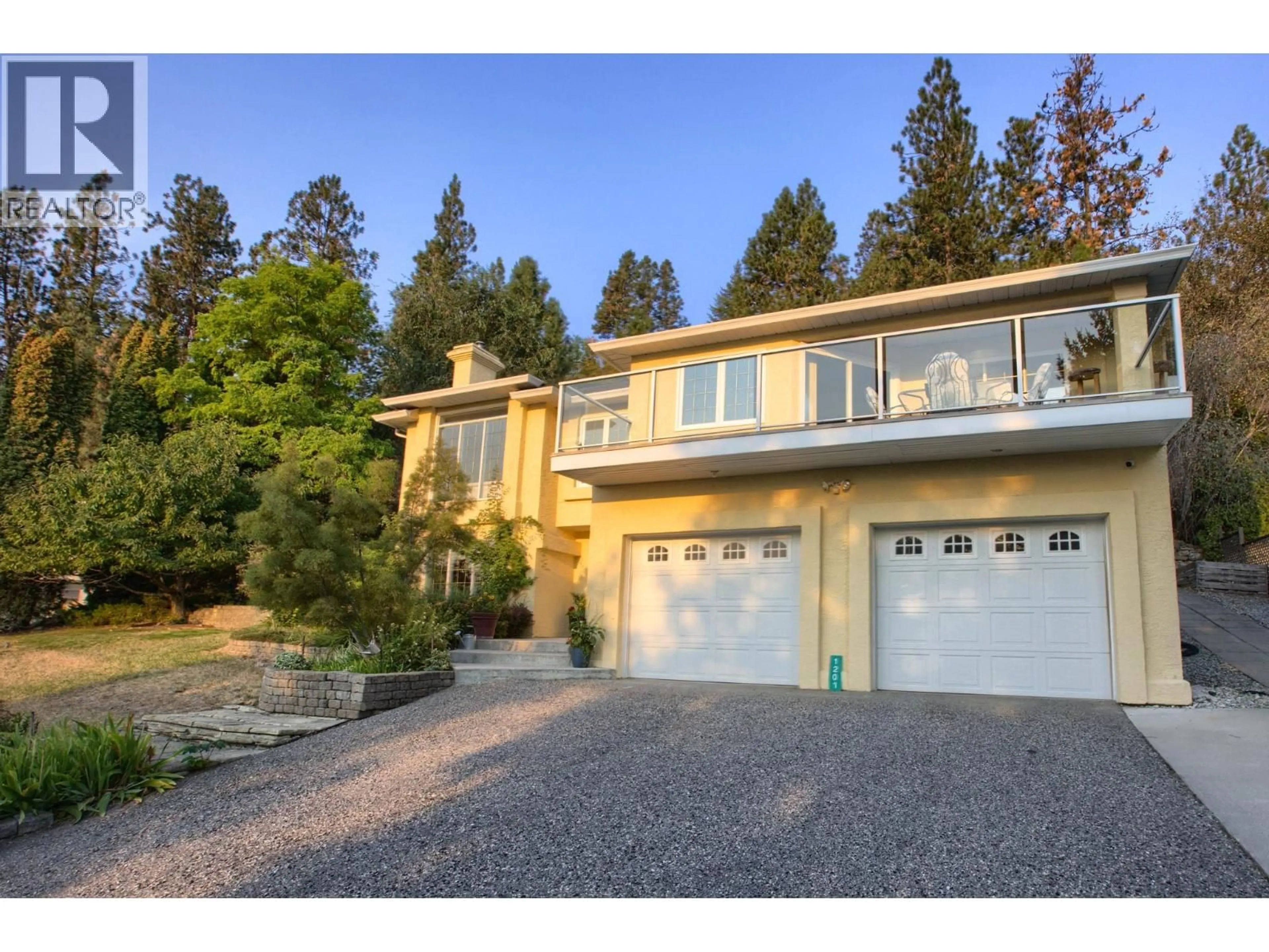 Home with vinyl exterior material, street for 1201 TREVOR DRIVE, West Kelowna British Columbia V1Z3K7