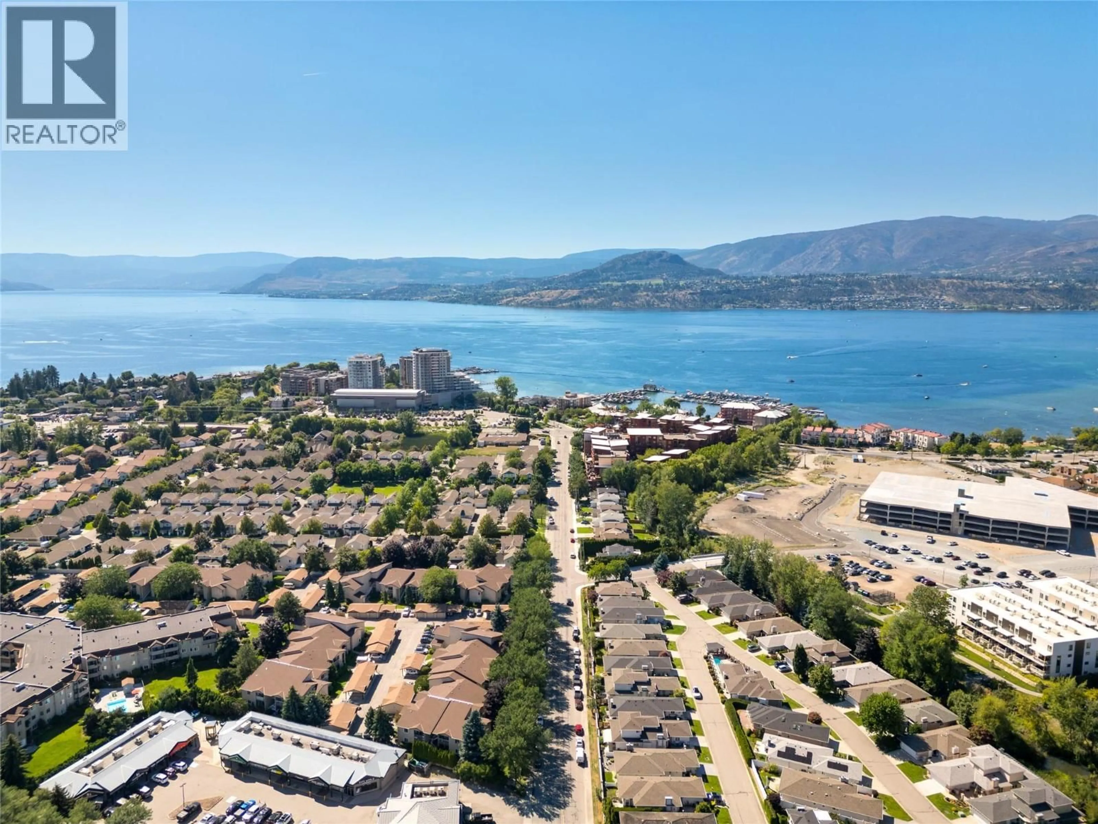 A pic from outside/outdoor area/front of a property/back of a property/a pic from drone, water/lake/river/ocean view for 203C - 735 COOK ROAD, Kelowna British Columbia V1W3G6