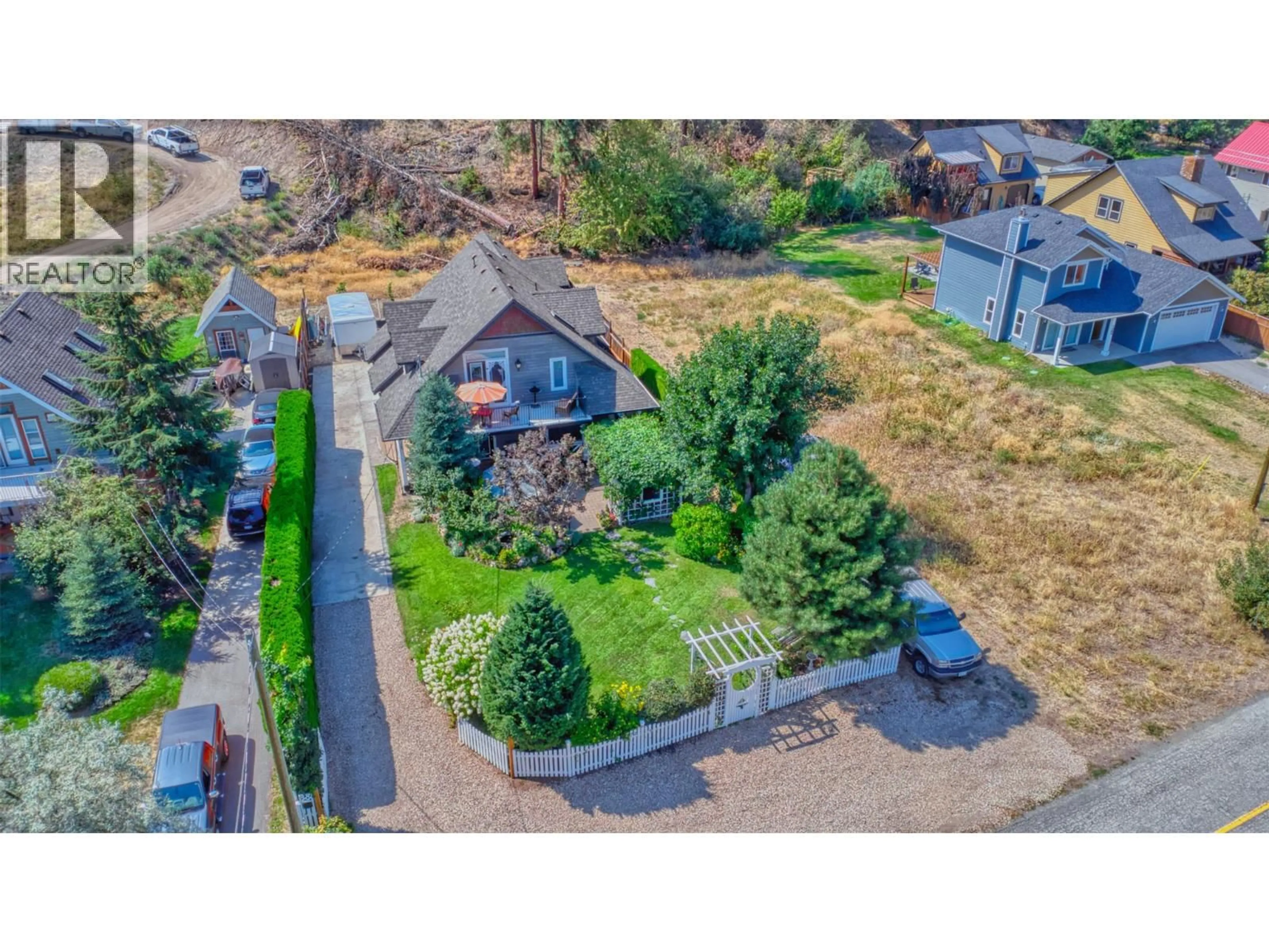 A pic from outside/outdoor area/front of a property/back of a property/a pic from drone, street for 7372 FINTRY DELTA ROAD, Kelowna British Columbia V1Z3V2