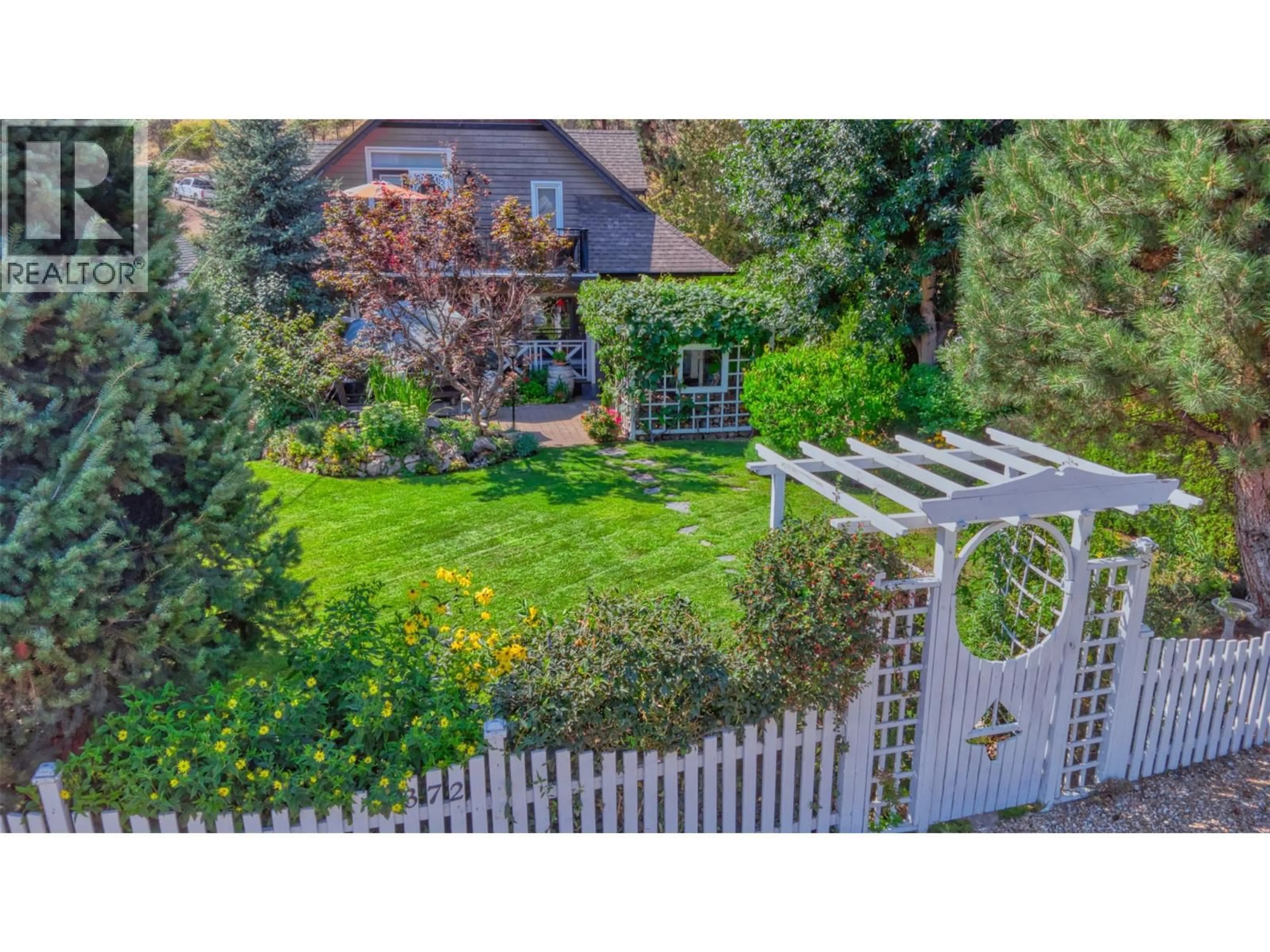 A pic from outside/outdoor area/front of a property/back of a property/a pic from drone, street for 7372 FINTRY DELTA ROAD, Kelowna British Columbia V1Z3V2