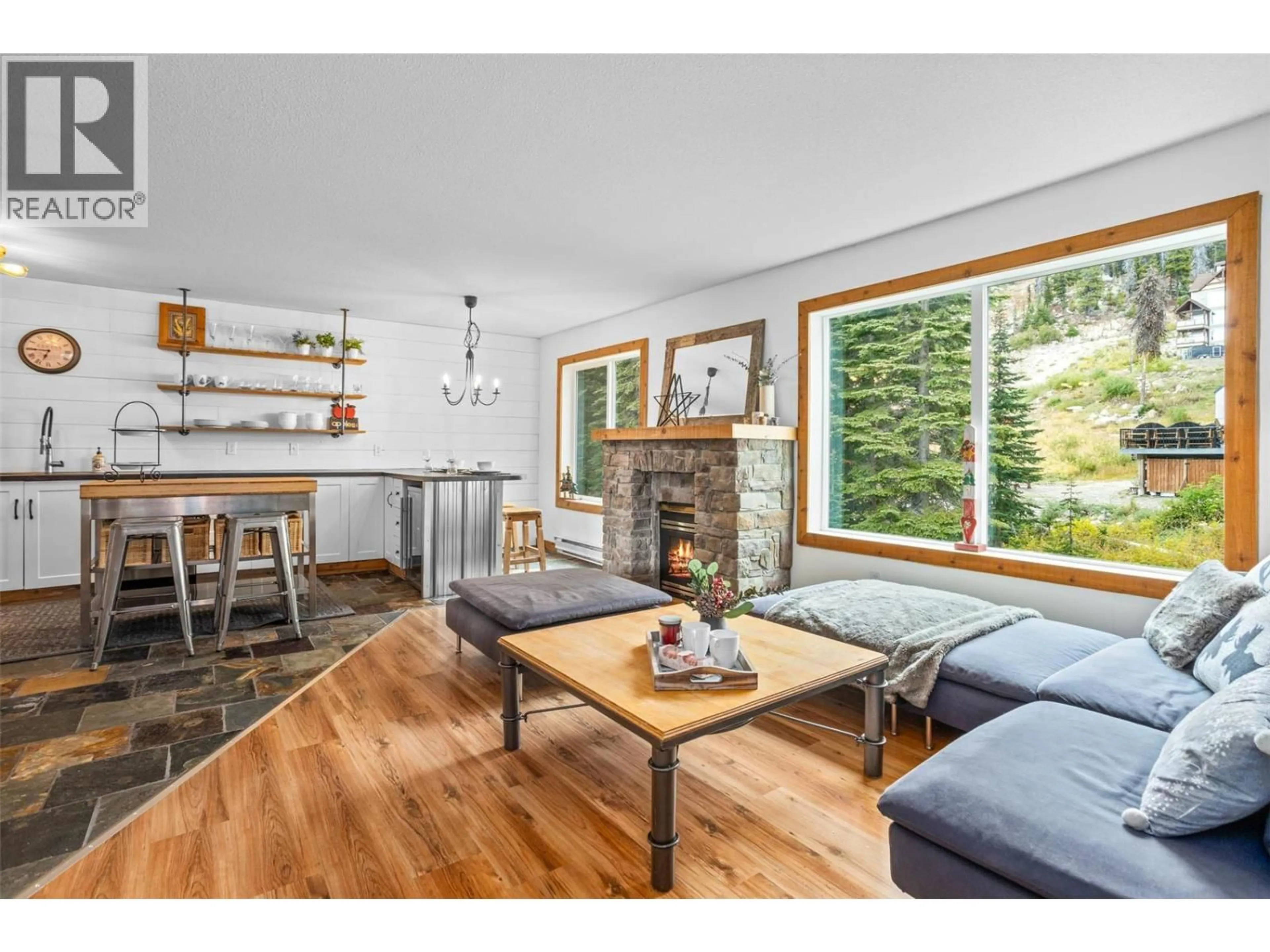 Living room with furniture, wood/laminate floor for 437F - 40 KETTLE VIEW ROAD, Big White British Columbia V1P1P3