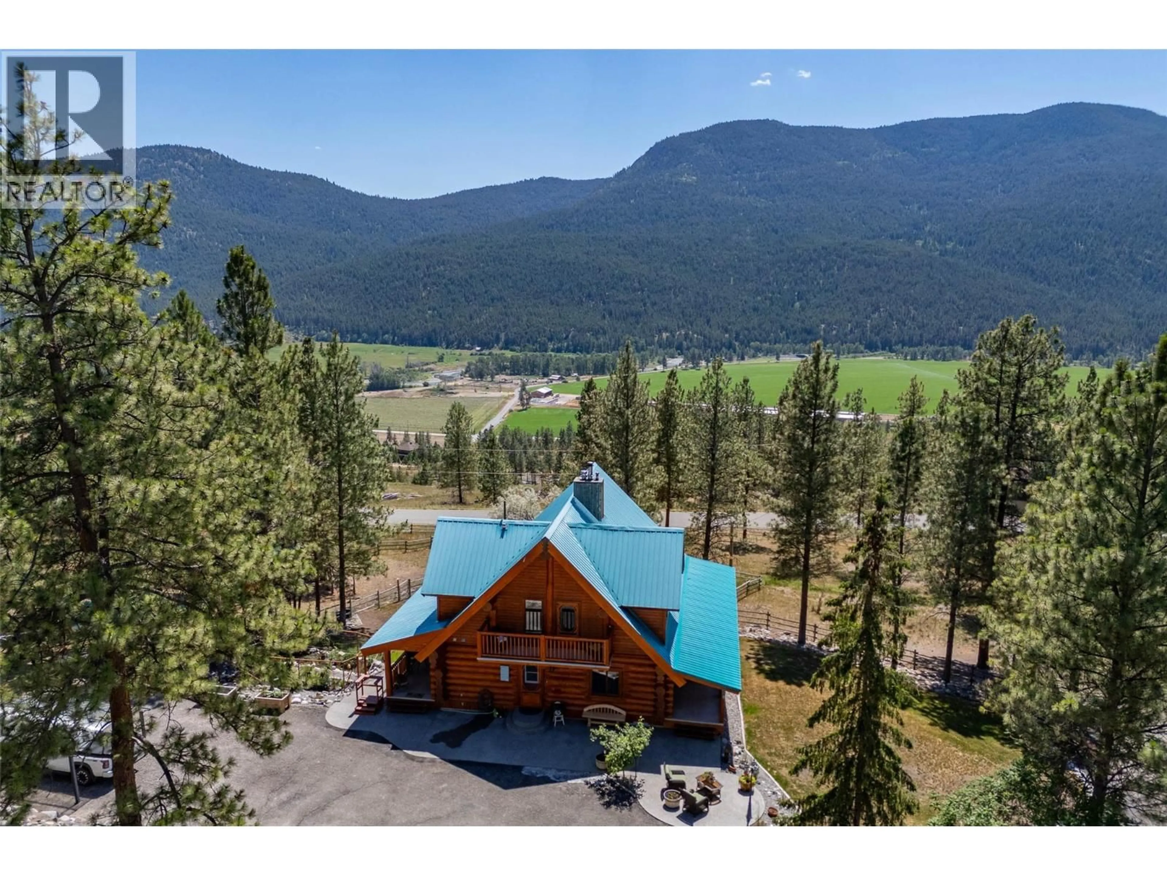 A pic from outside/outdoor area/front of a property/back of a property/a pic from drone, mountain view for 1761 MILLER ROAD, Merritt British Columbia V1K1R8