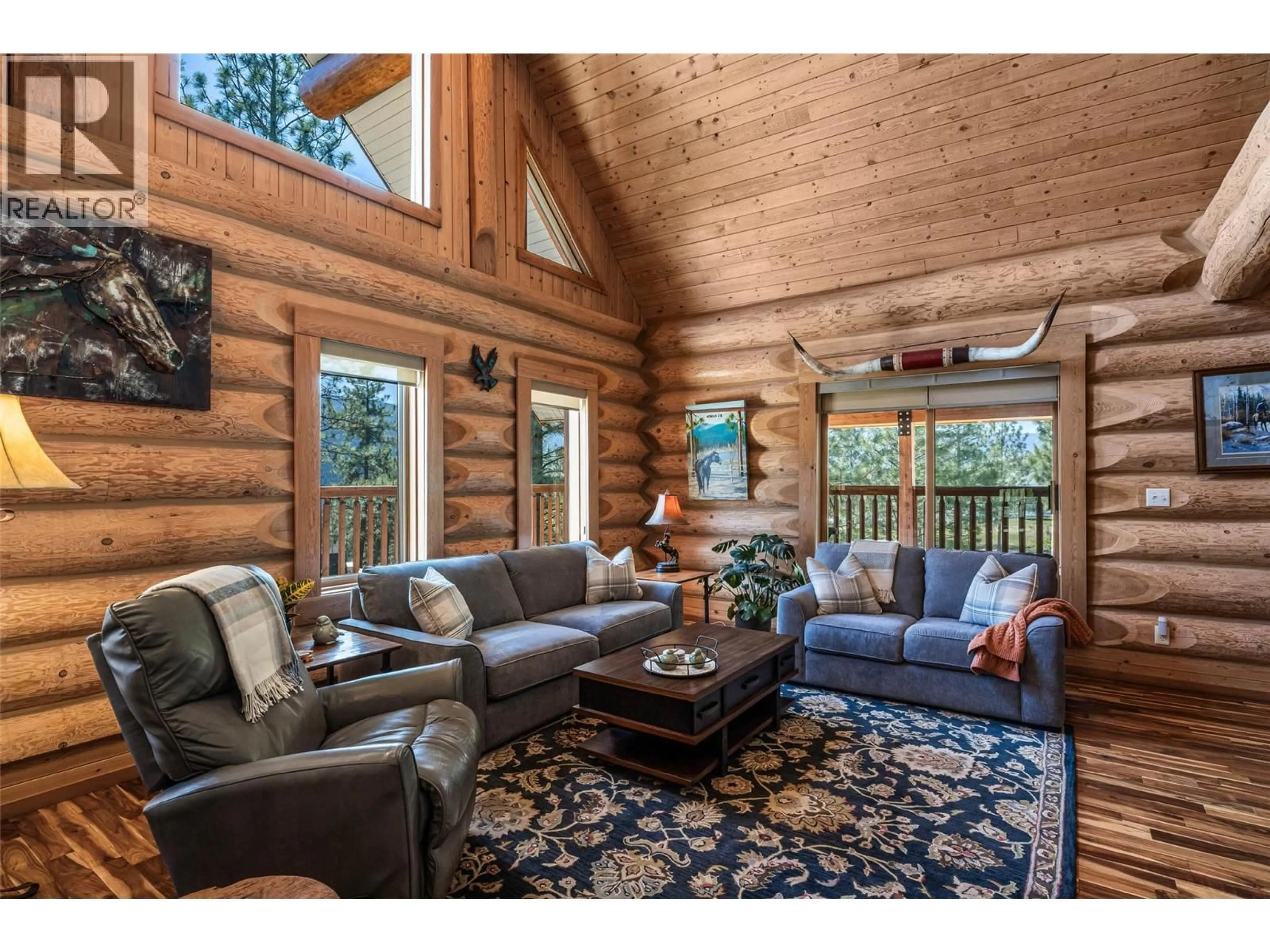 Living room with furniture, wood/laminate floor for 1761 MILLER ROAD, Merritt British Columbia V1K1R8