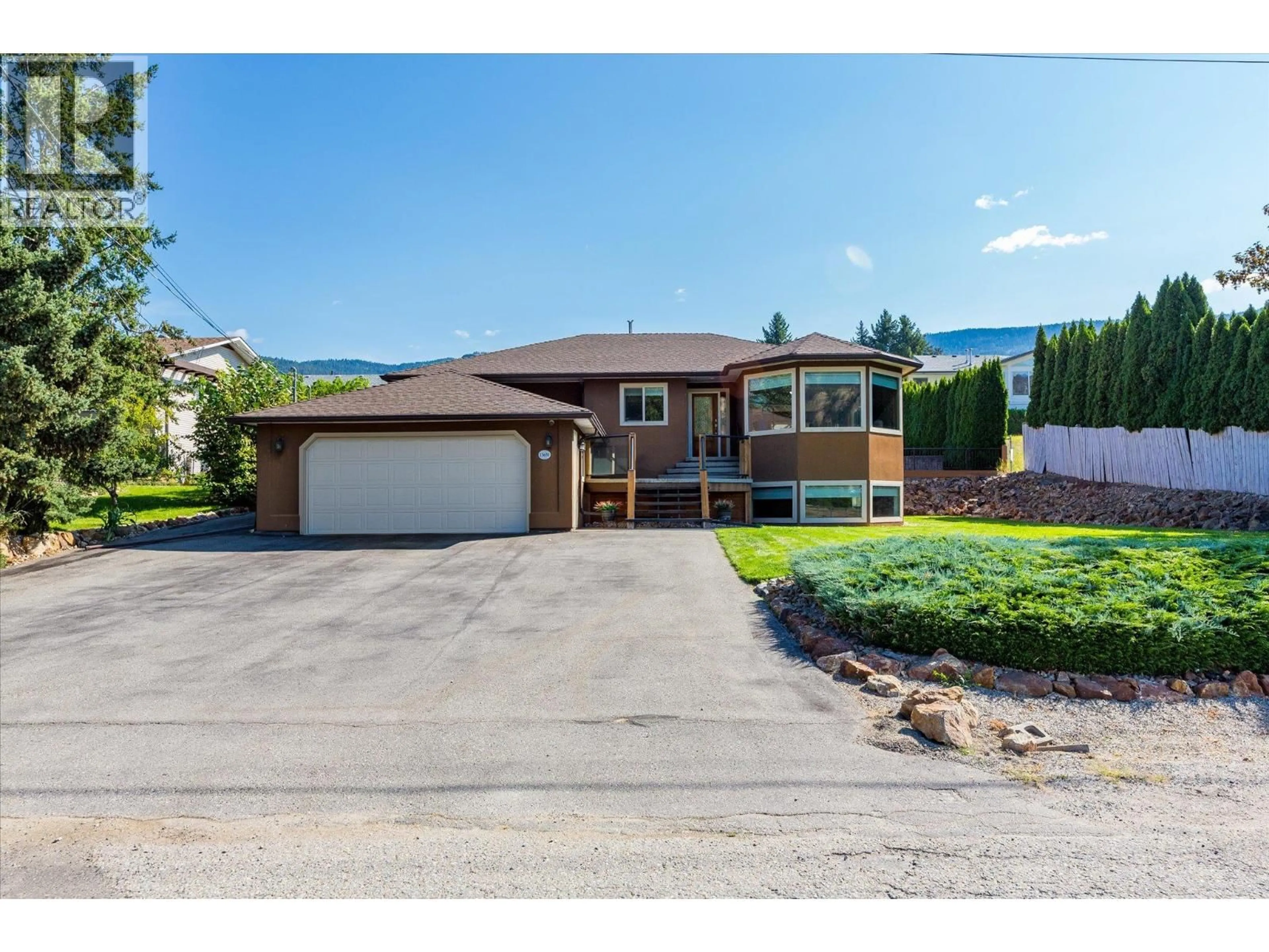 Home with vinyl exterior material, street for 15651 TRASK ROAD, Lake Country British Columbia V4V2H9