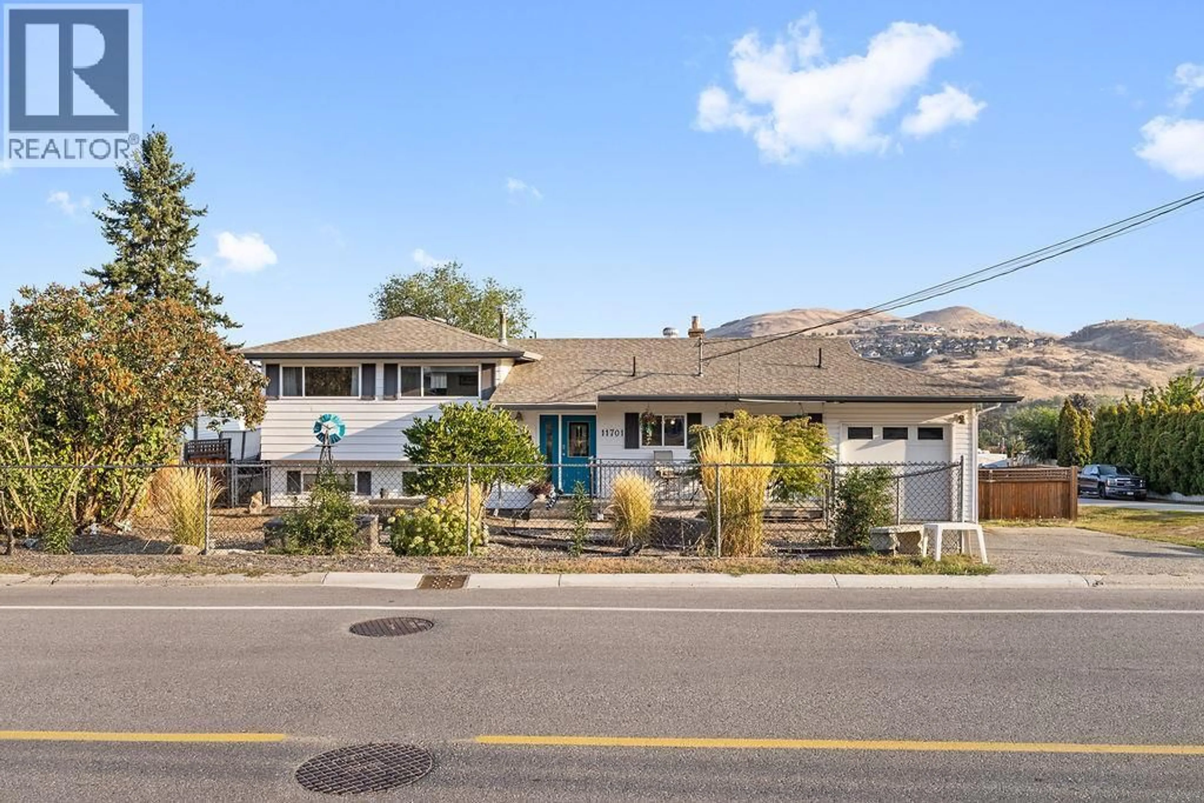Home with vinyl exterior material, street for 11701 COLDSTREAM CREEK ROAD, Coldstream British Columbia V1B1E5