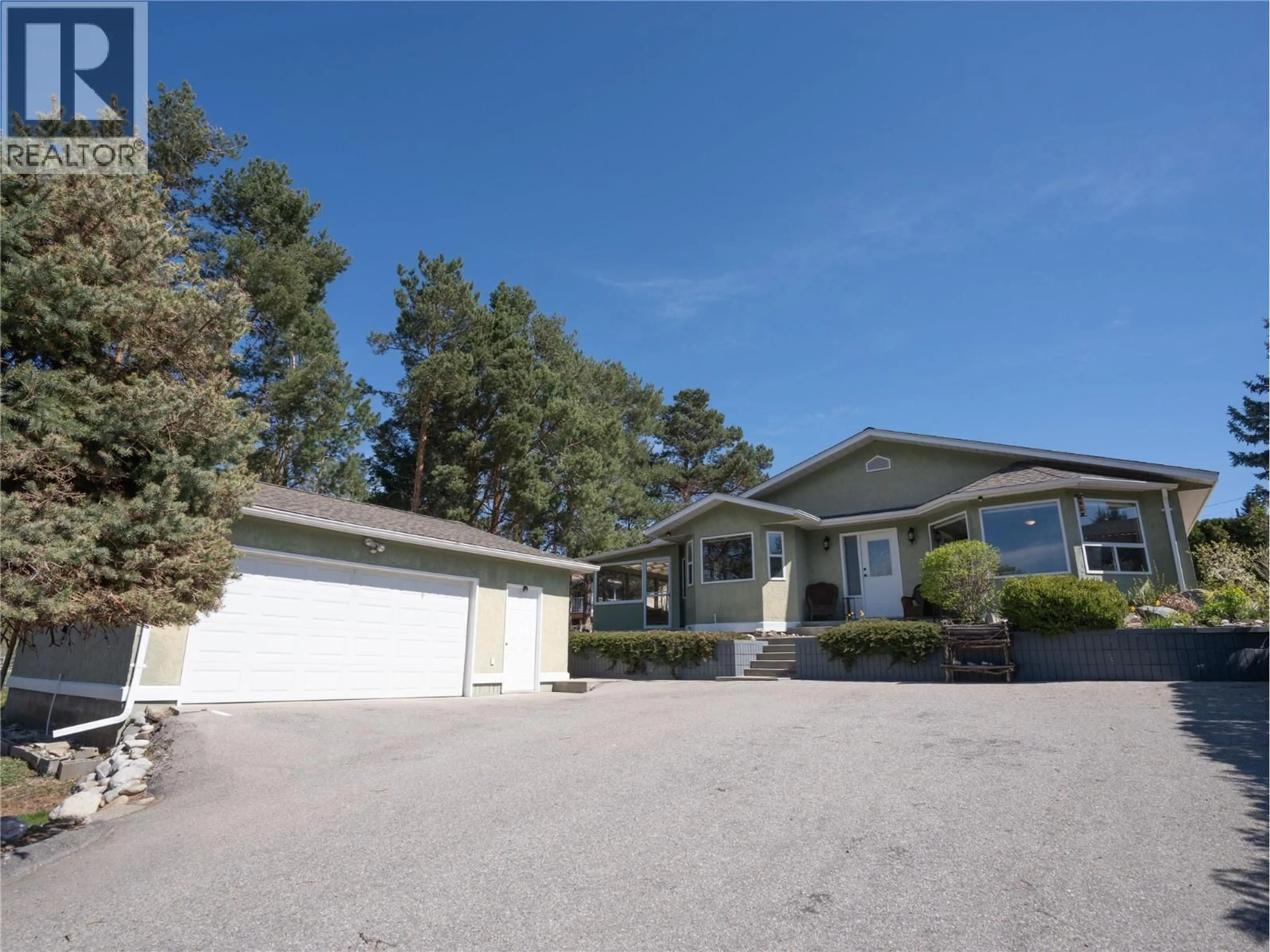 Home with vinyl exterior material, street for 101 MCGOWAN ROAD, Oliver British Columbia V0H1T2