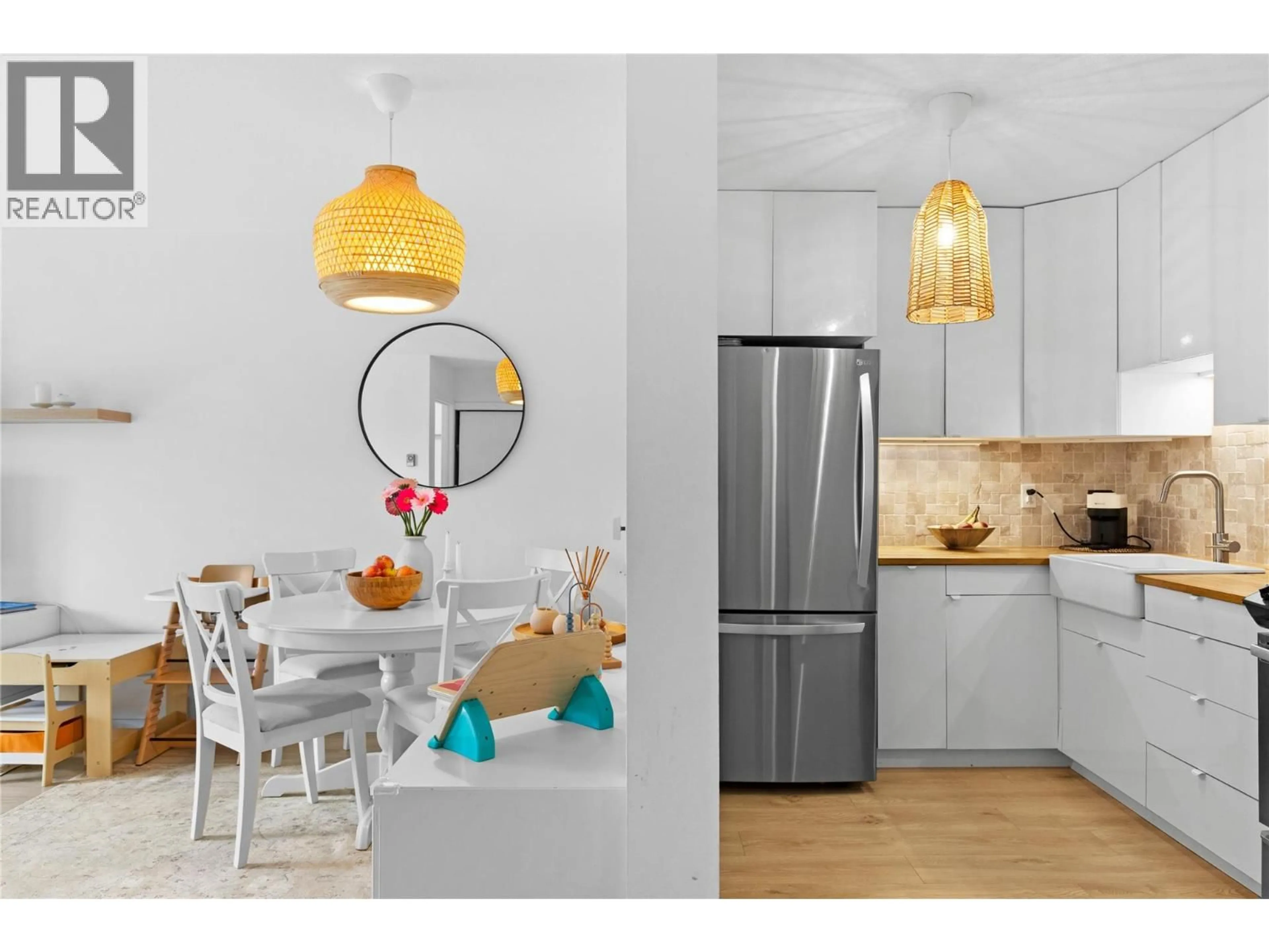 Open concept kitchen, wood/laminate floor for 406 - 3160 DE MONTREUIL COURT, Kelowna British Columbia V1W3W3