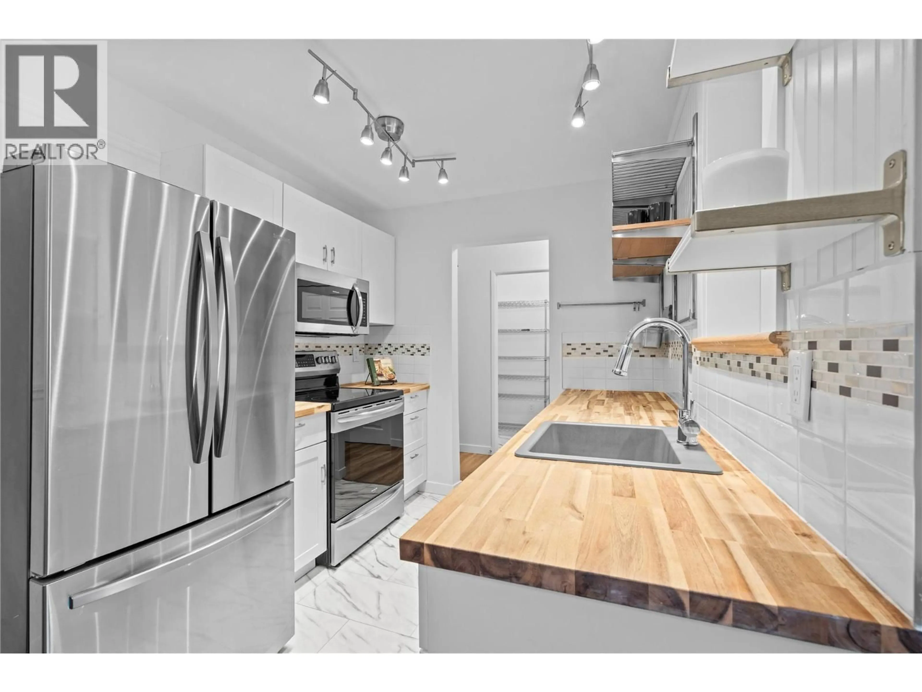 Open concept kitchen, unknown for 310 - 3180 DE MONTREUIL COURT, Kelowna British Columbia V1W3W4