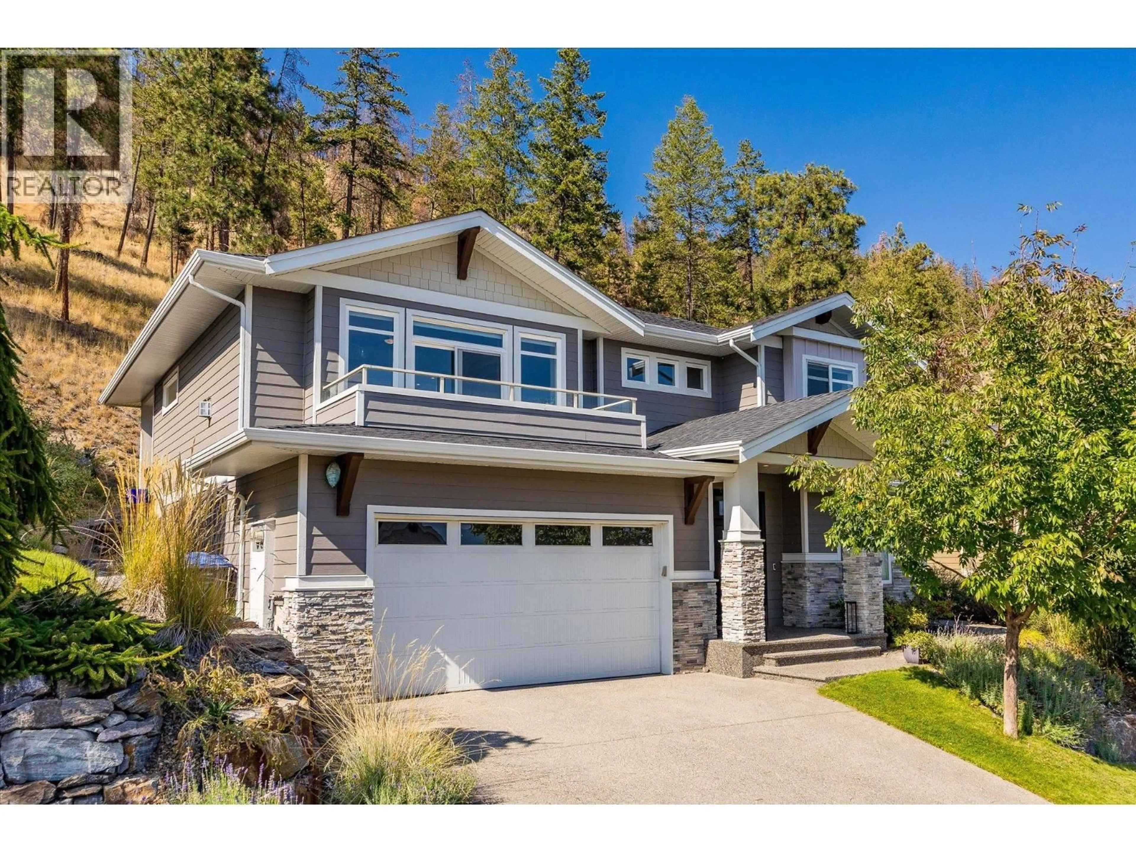 Home with vinyl exterior material, street for 218 UPPER CANYON DRIVE NORTH, Kelowna British Columbia V1V2X6