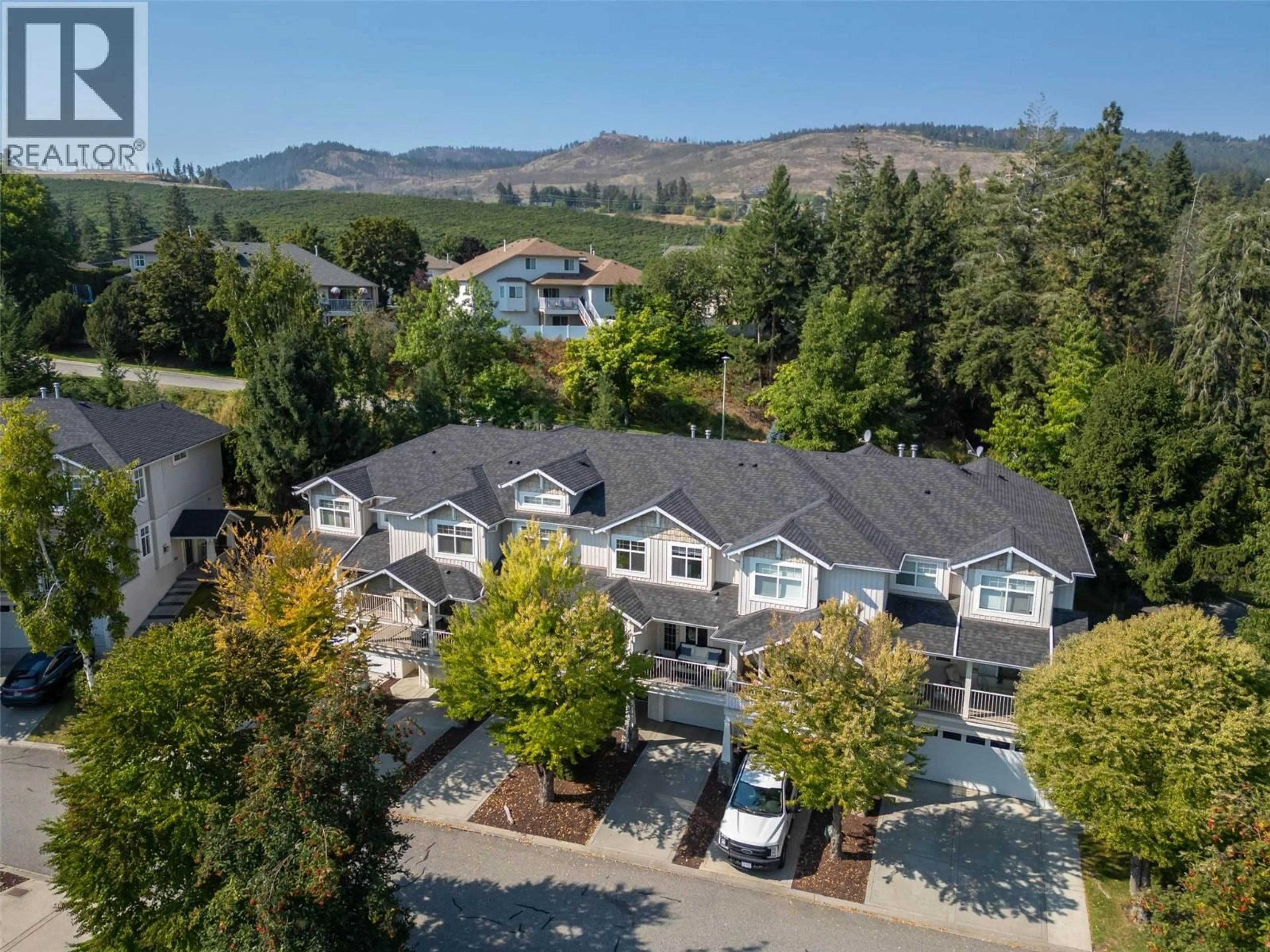 A pic from outside/outdoor area/front of a property/back of a property/a pic from drone, mountain view for 103 - 3825 GLEN CANYON DRIVE, West Kelowna British Columbia V4T2T4