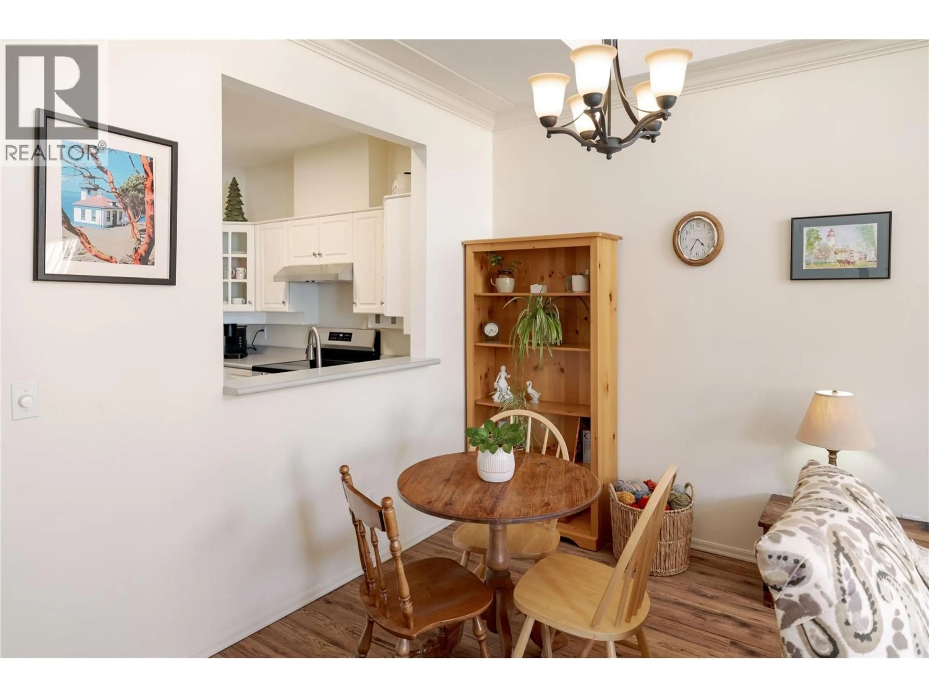 Dining room, wood/laminate floor for 311 - 877 KLO ROAD, Kelowna British Columbia V1Y9R1