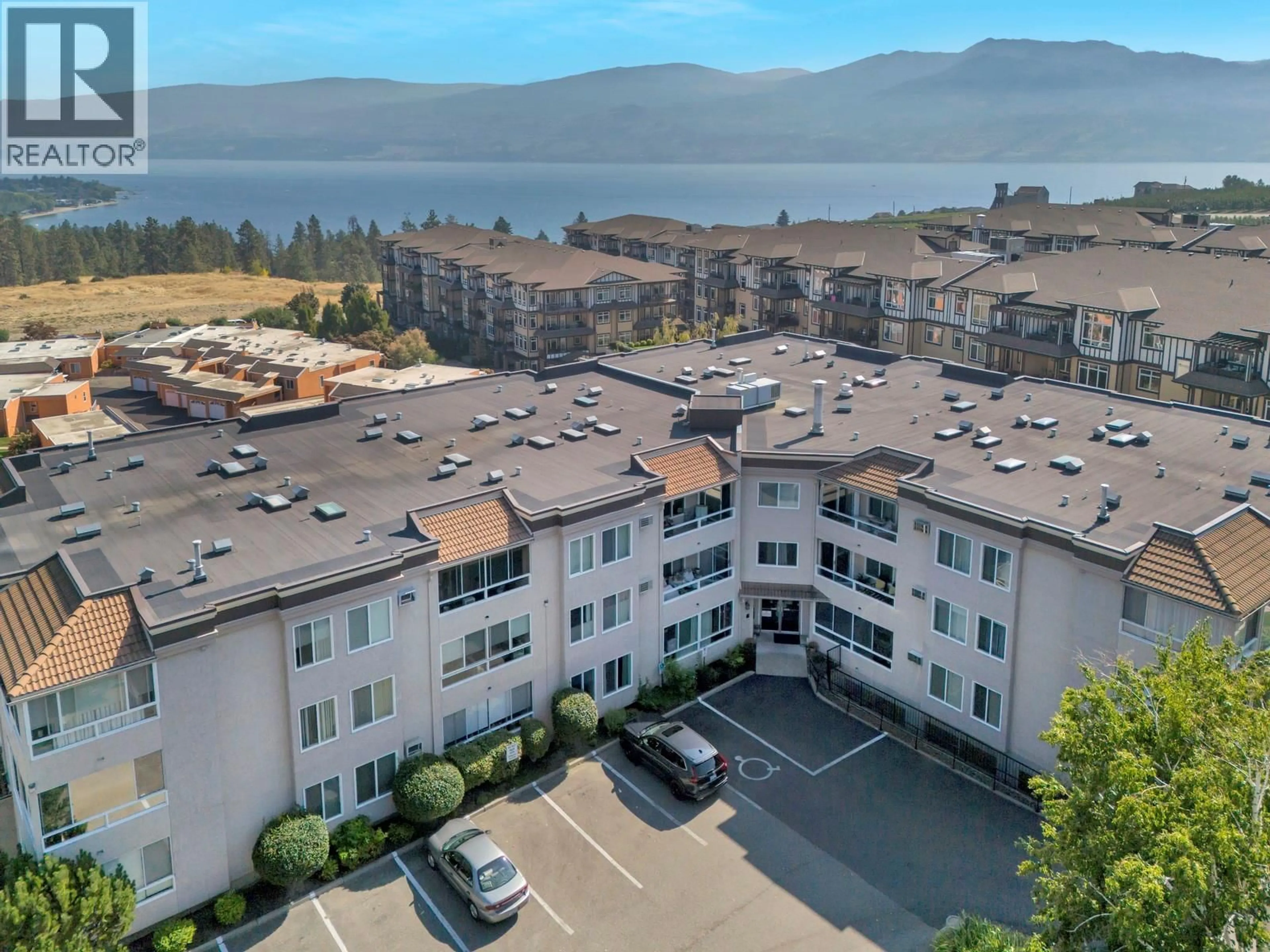 A pic from outside/outdoor area/front of a property/back of a property/a pic from drone, water/lake/river/ocean view for 304 - 3815 BROWN ROAD, West Kelowna British Columbia V4T1R8