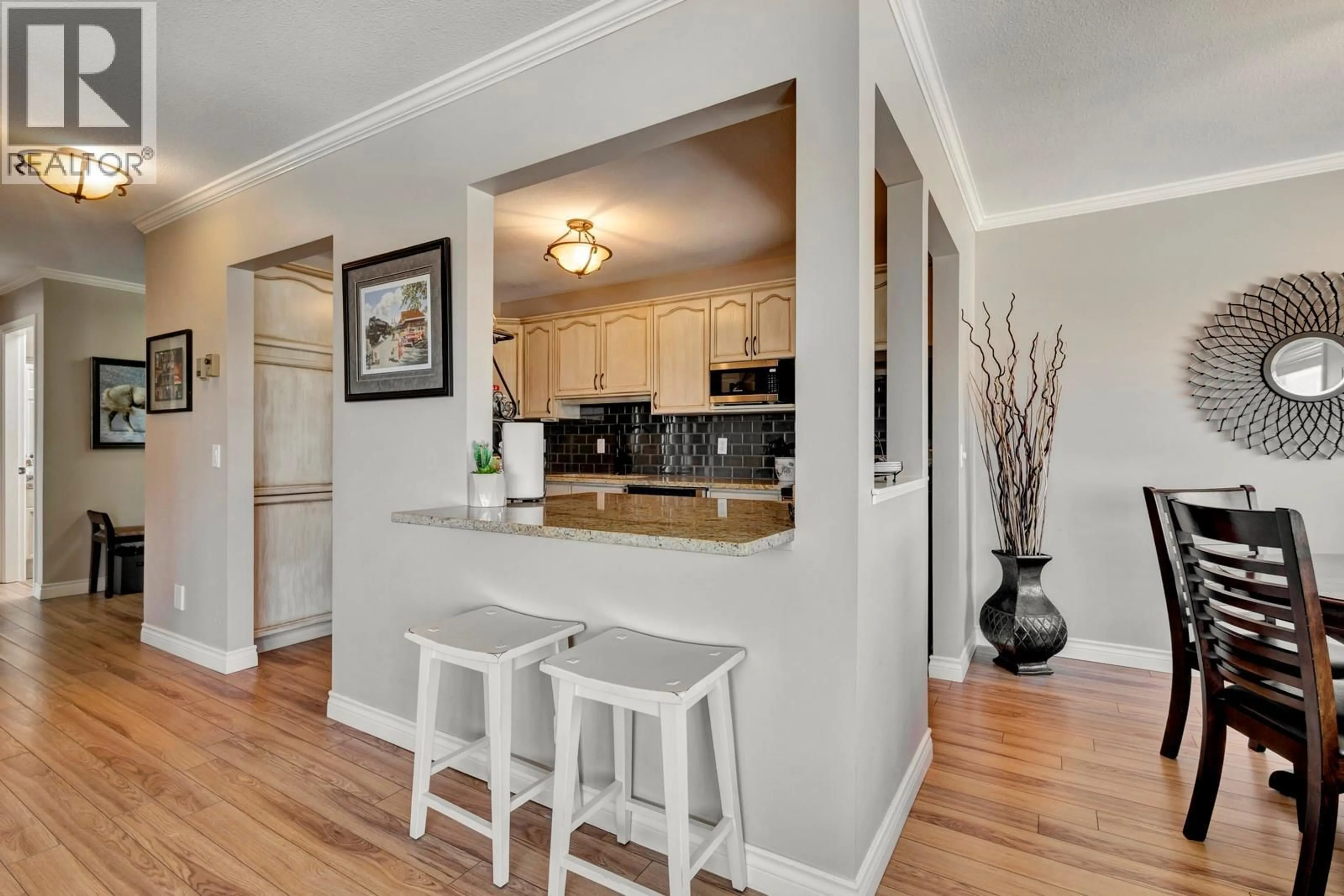 Open concept kitchen, wood/laminate floor for 304 - 3815 BROWN ROAD, West Kelowna British Columbia V4T1R8