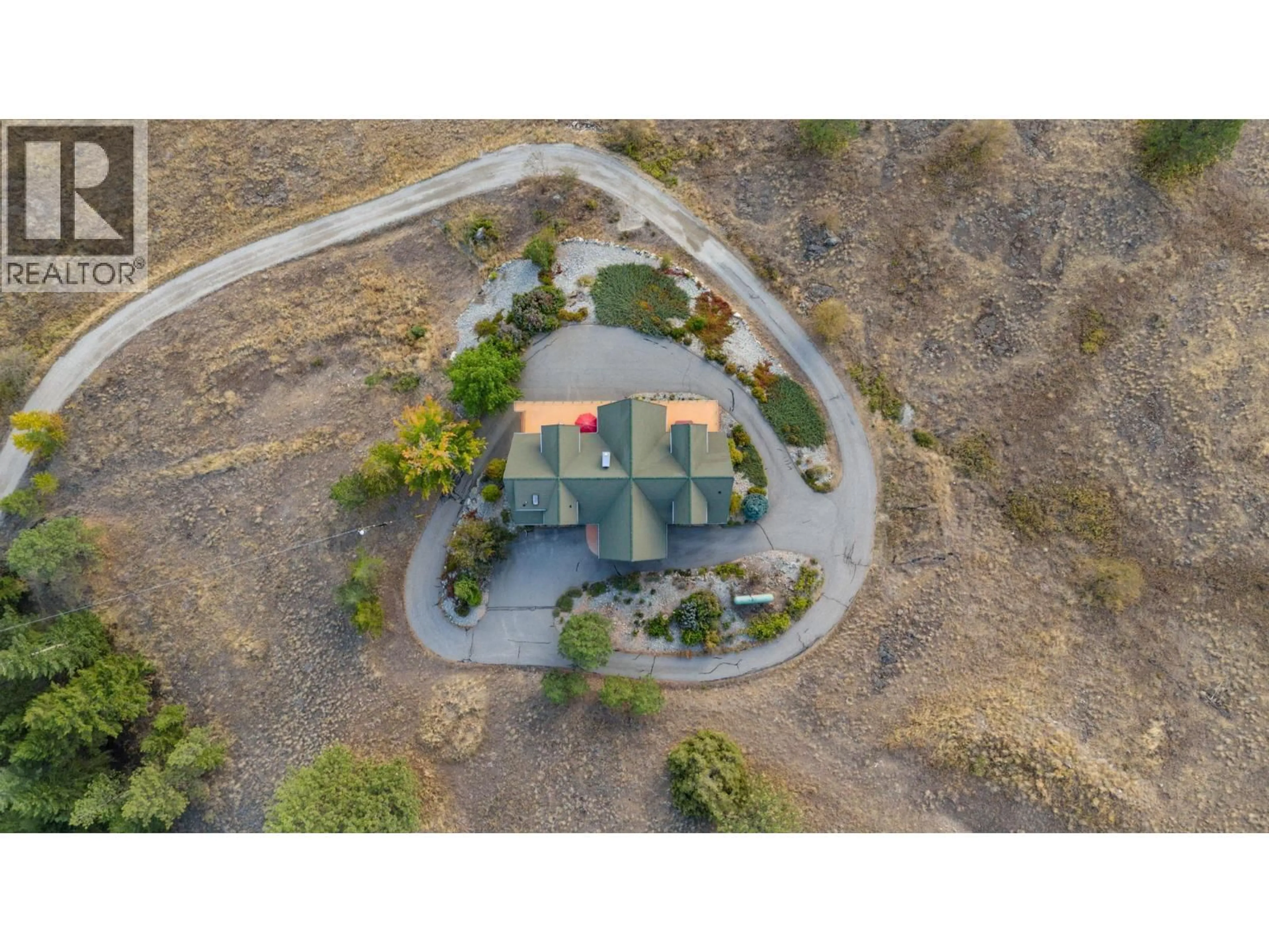 A pic from outside/outdoor area/front of a property/back of a property/a pic from drone, street for 4520 FARMERS DRIVE, Kelowna British Columbia V1P1A3
