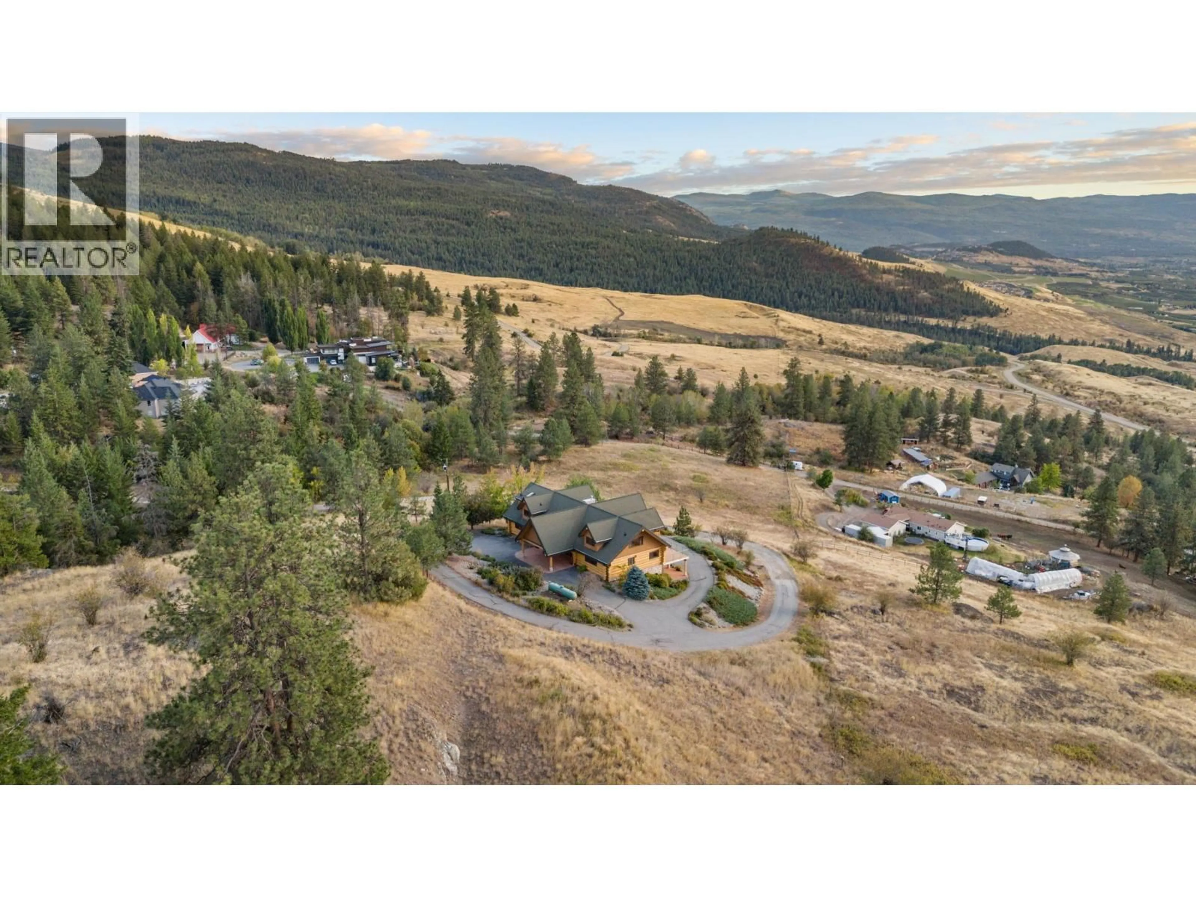 A pic from outside/outdoor area/front of a property/back of a property/a pic from drone, mountain view for 4520 FARMERS DRIVE, Kelowna British Columbia V1P1A3