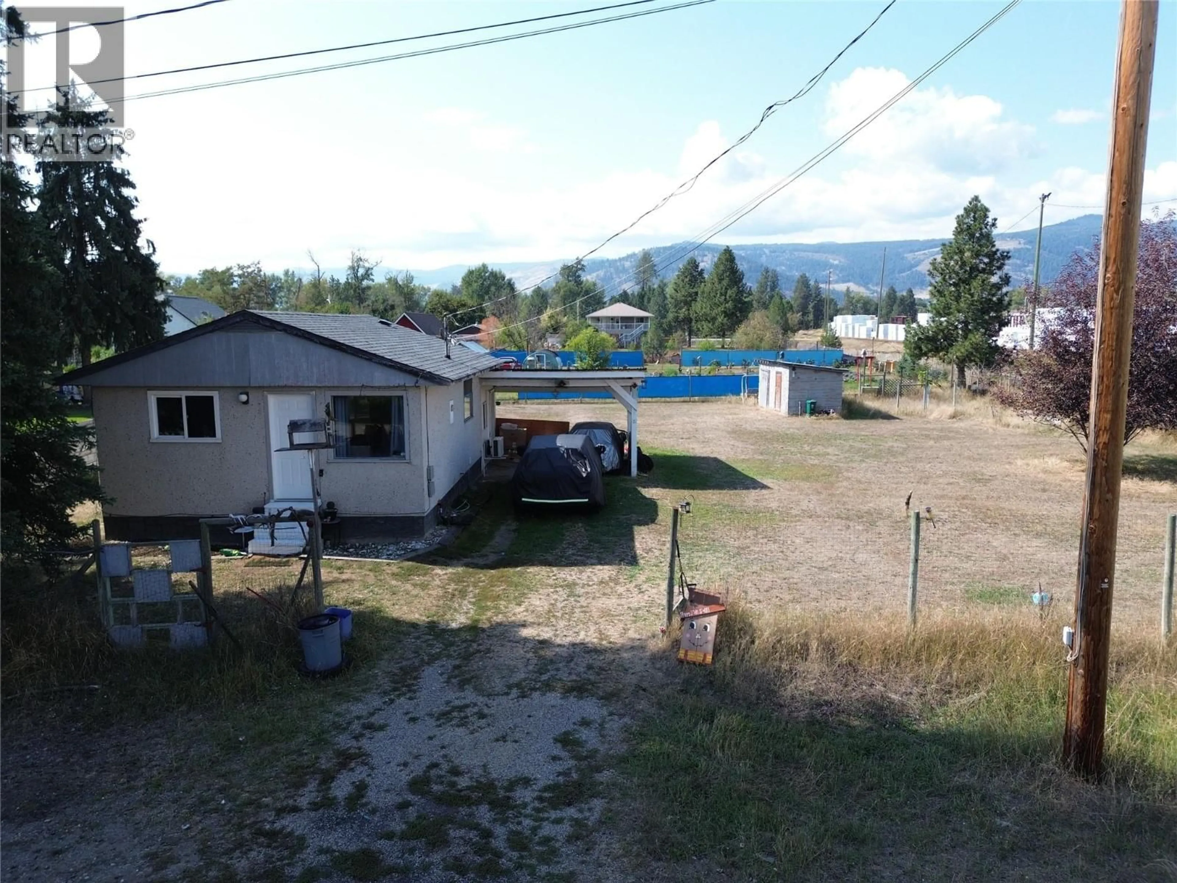 A pic from outside/outdoor area/front of a property/back of a property/a pic from drone, mountain view for 6657 COMO STREET, Grand Forks British Columbia V0H1H4