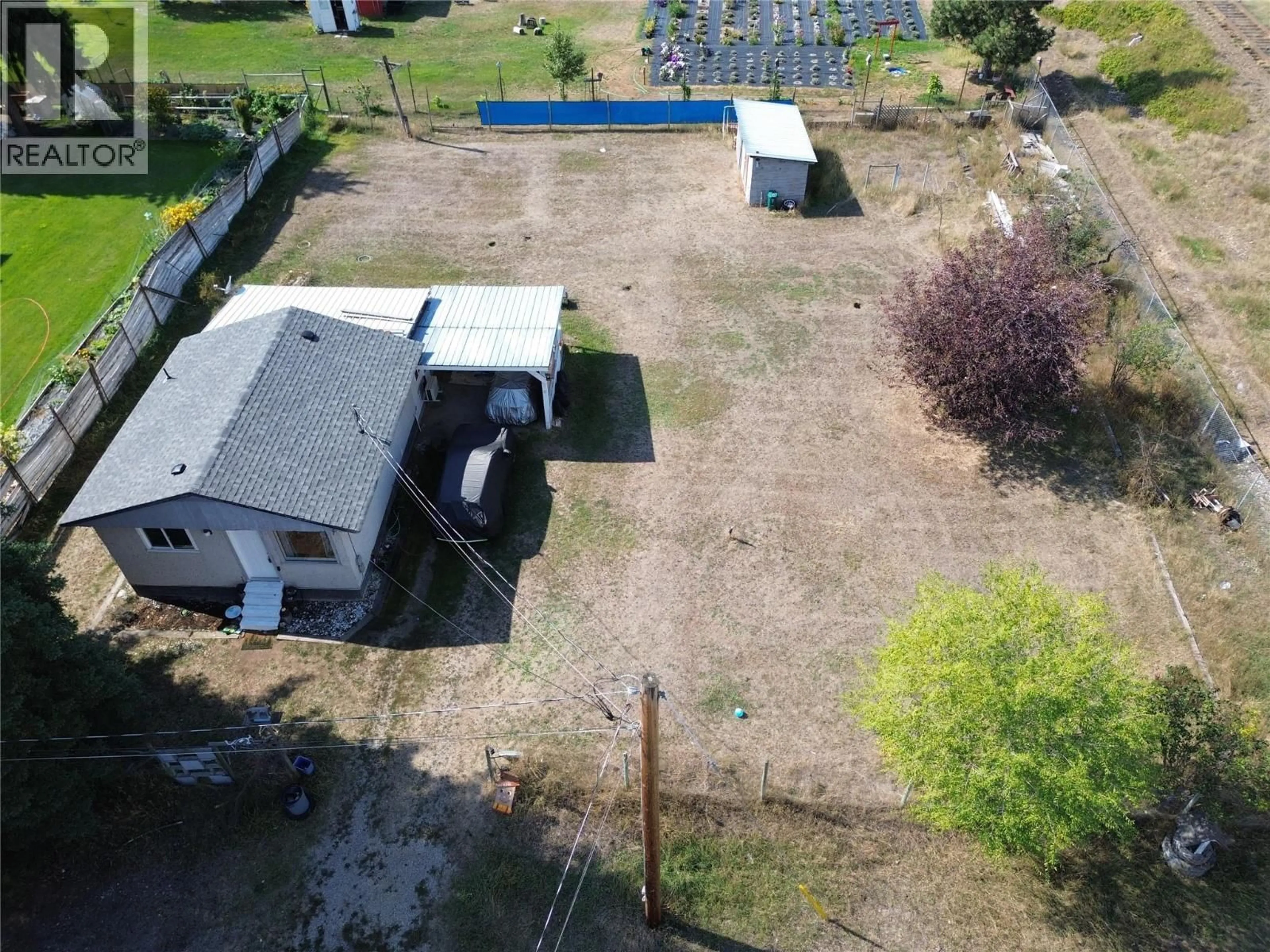 A pic from outside/outdoor area/front of a property/back of a property/a pic from drone, unknown for 6657 COMO STREET, Grand Forks British Columbia V0H1H4