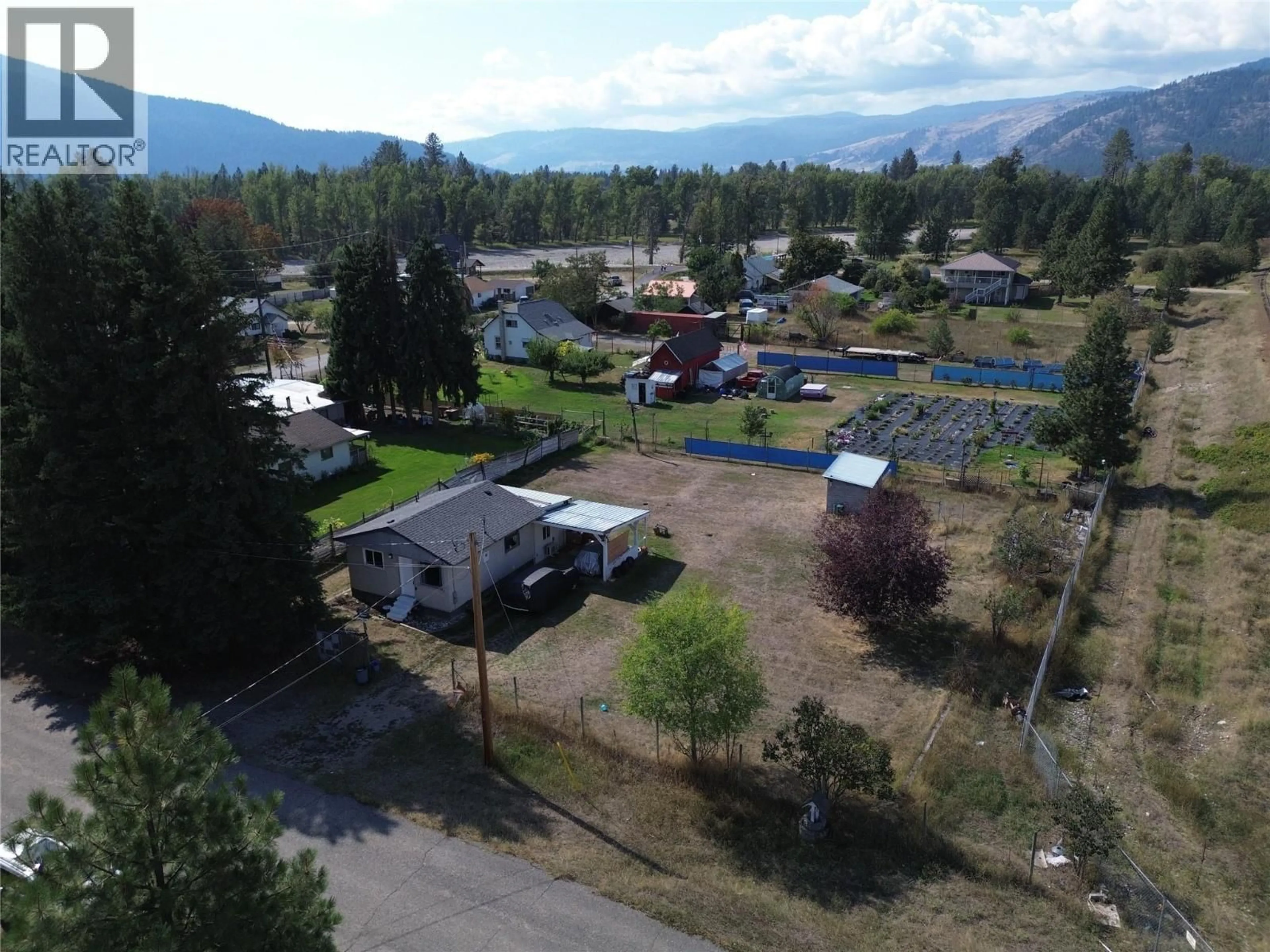 A pic from outside/outdoor area/front of a property/back of a property/a pic from drone, mountain view for 6657 COMO STREET, Grand Forks British Columbia V0H1H4