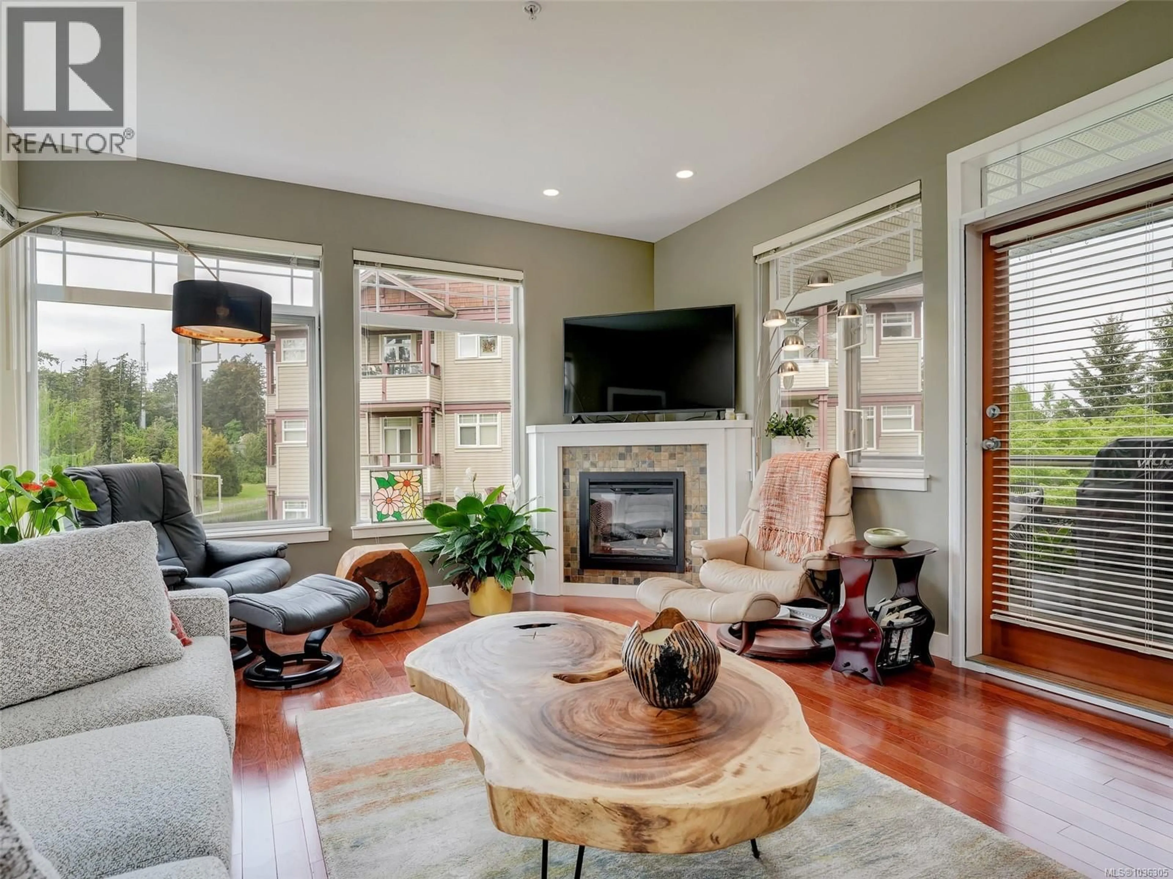 Living room with furniture, wood/laminate floor for 306D - 1115 CRAIGFLOWER ROAD, Esquimalt British Columbia V9A7R1