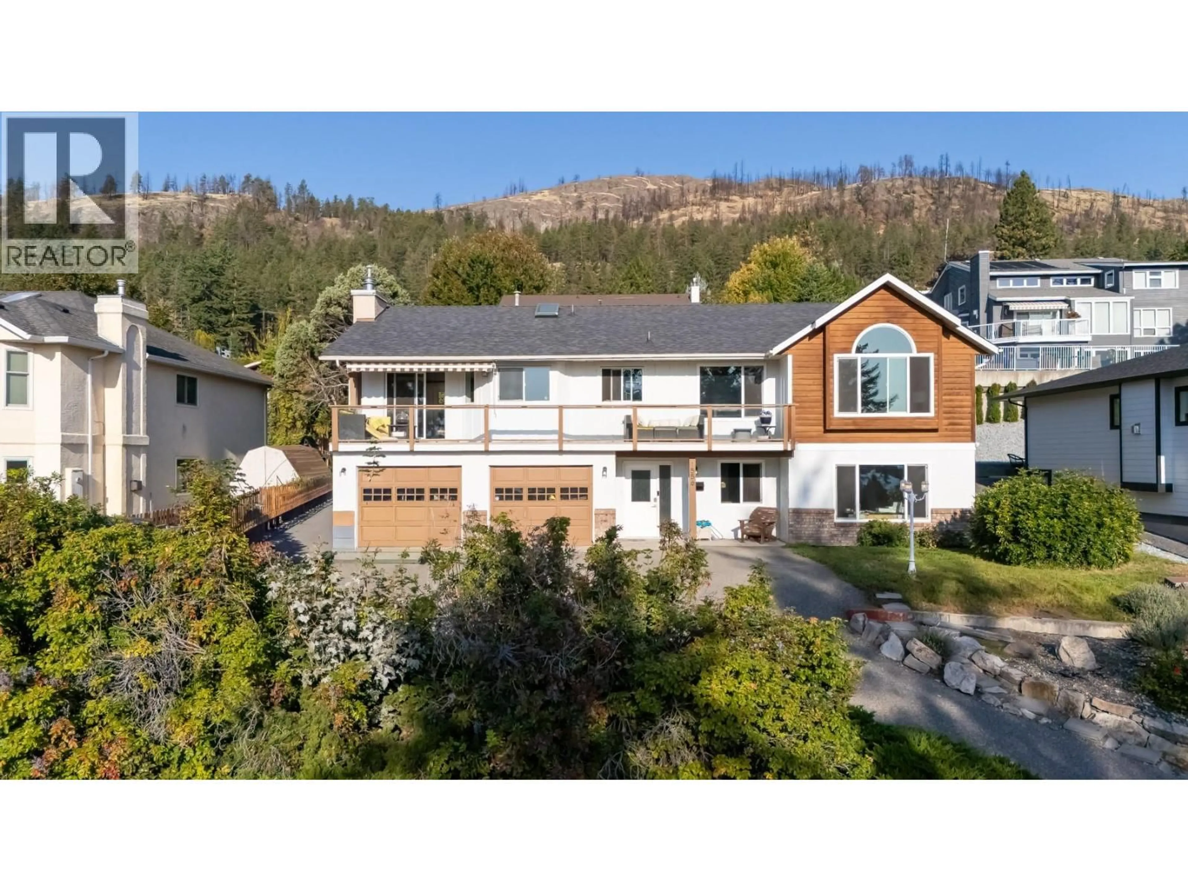 A pic from outside/outdoor area/front of a property/back of a property/a pic from drone, mountain view for 1556 BLACKWOOD DRIVE, West Kelowna British Columbia V1Z3B7