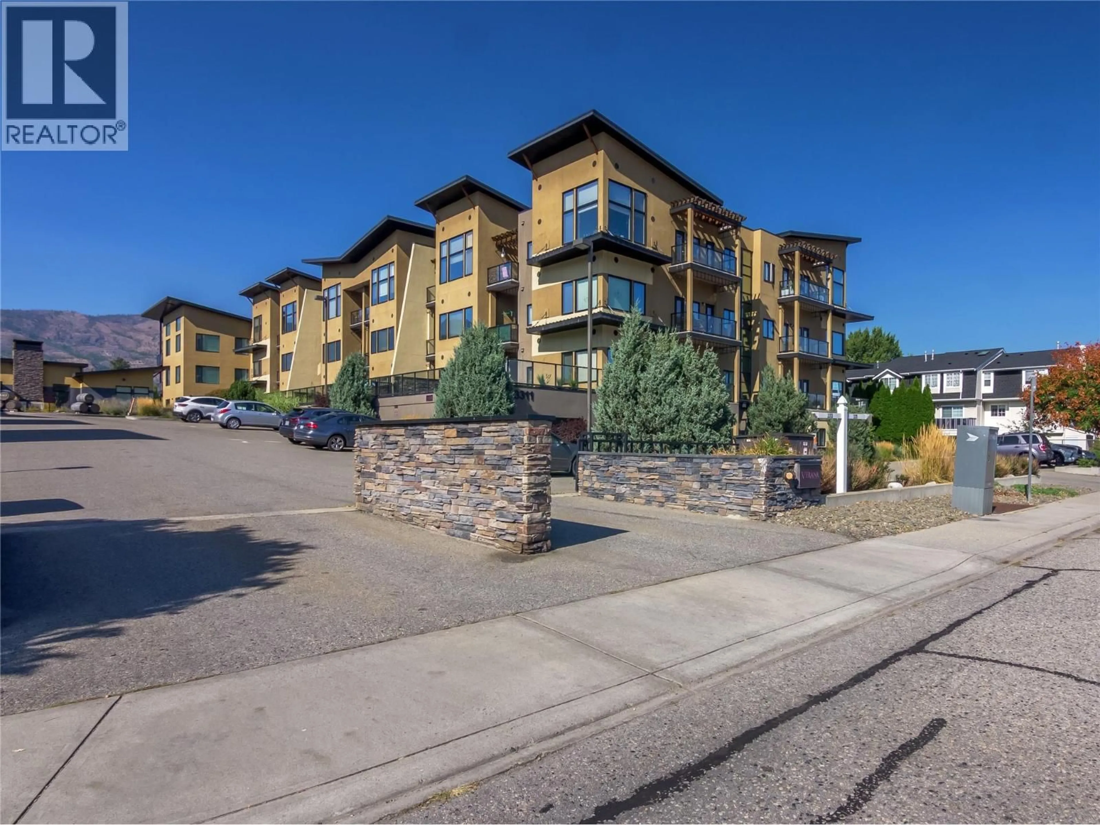 A pic from outside/outdoor area/front of a property/back of a property/a pic from drone, unknown for 407 - 3311 WILSON STREET, Penticton British Columbia V2A8J3