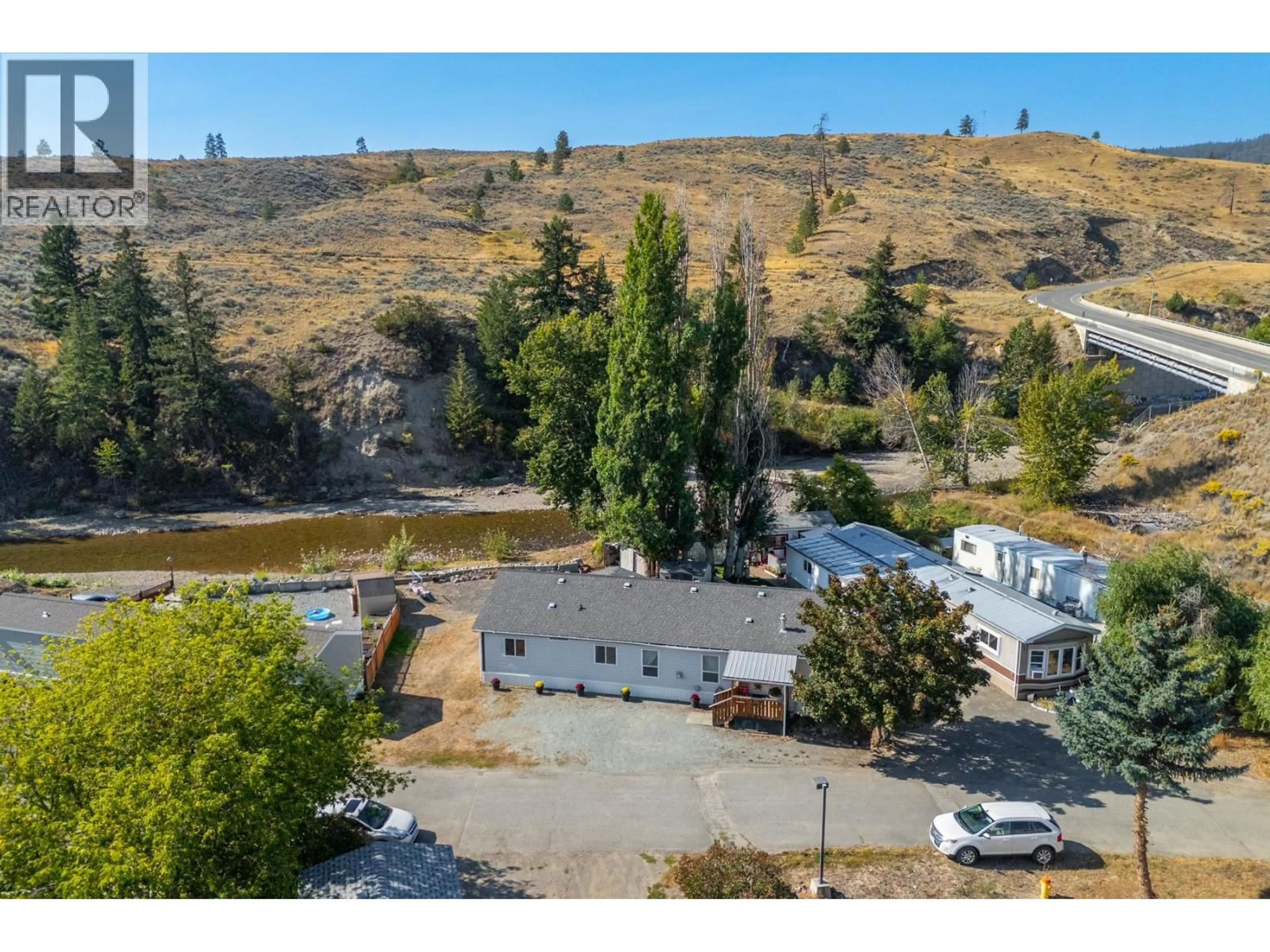 A pic from outside/outdoor area/front of a property/back of a property/a pic from drone, mountain view for 34 - 1098 HOUSTON STREET, Merritt British Columbia V1K1C3