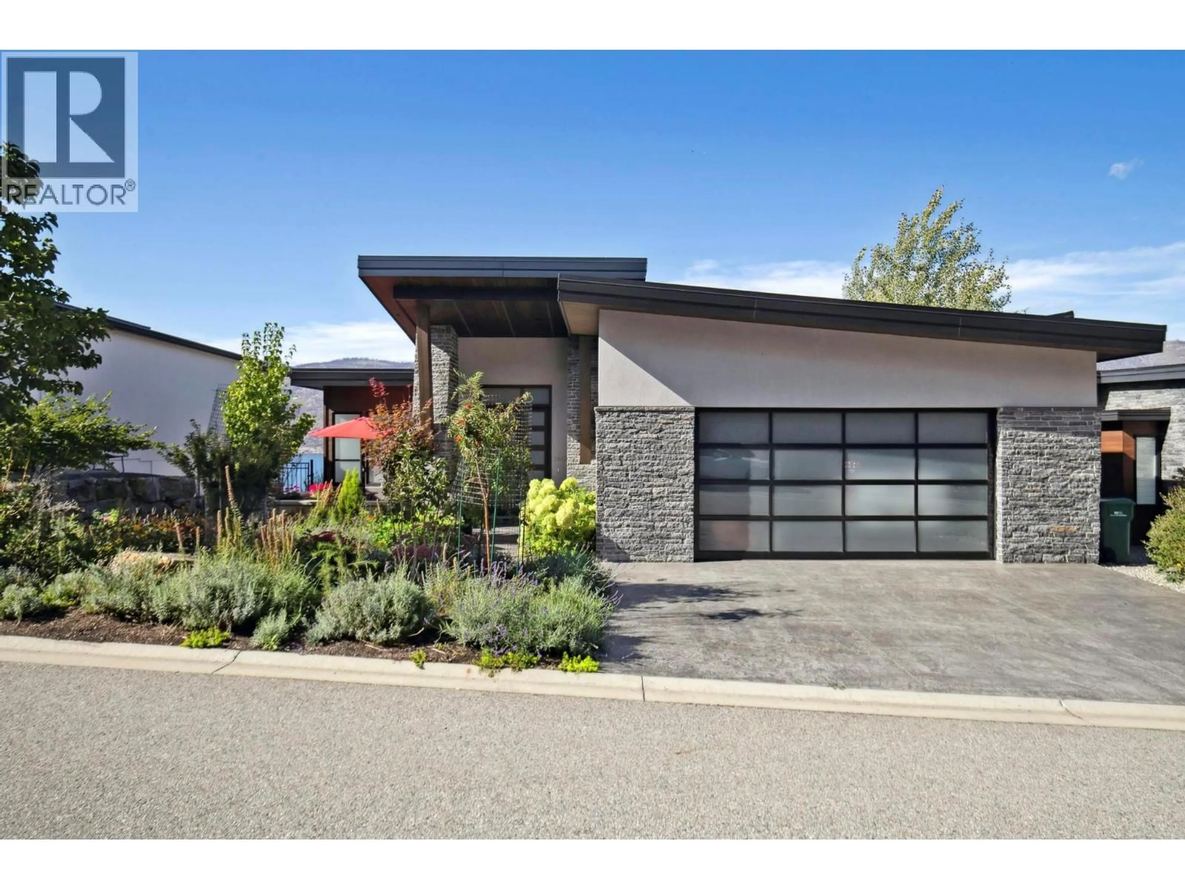 Home with brick exterior material, street for 1612 KIMBERLITE DRIVE, Lake Country British Columbia V4V2T4