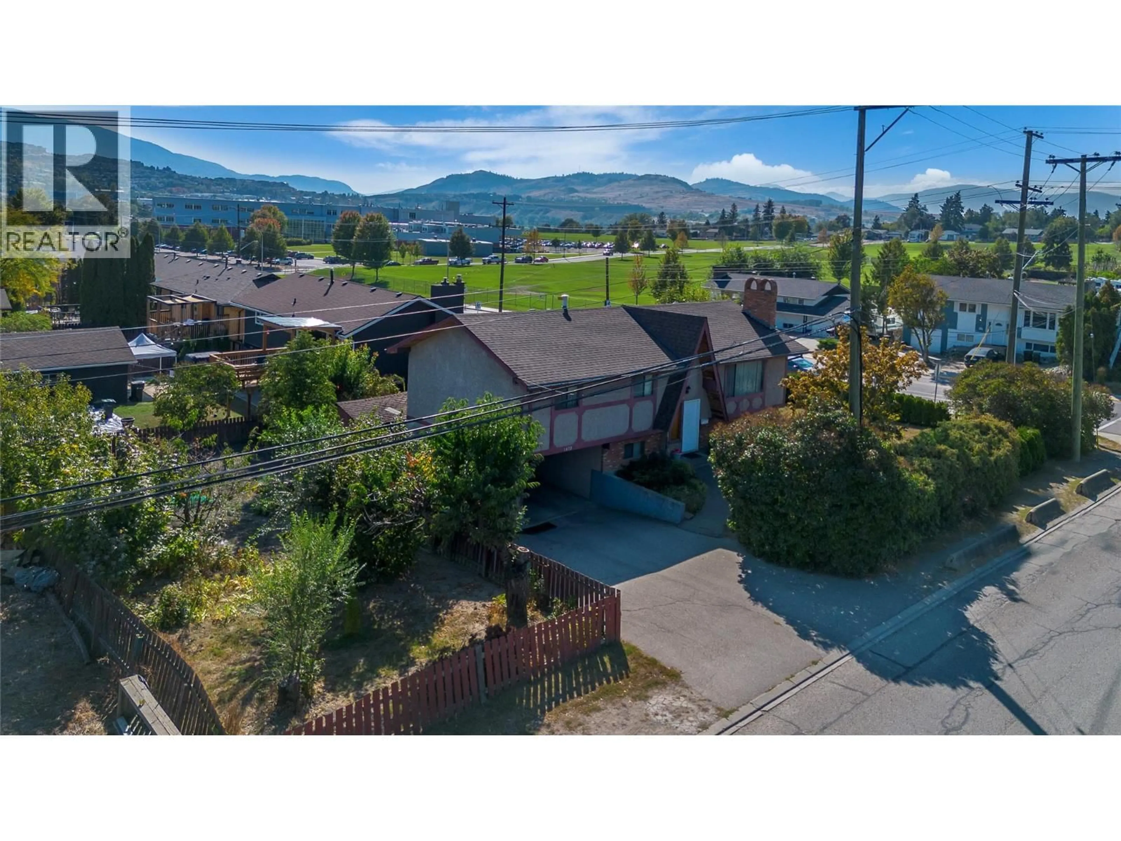 A pic from outside/outdoor area/front of a property/back of a property/a pic from drone, mountain view for 1472 25 AVENUE, Vernon British Columbia V1T1M5