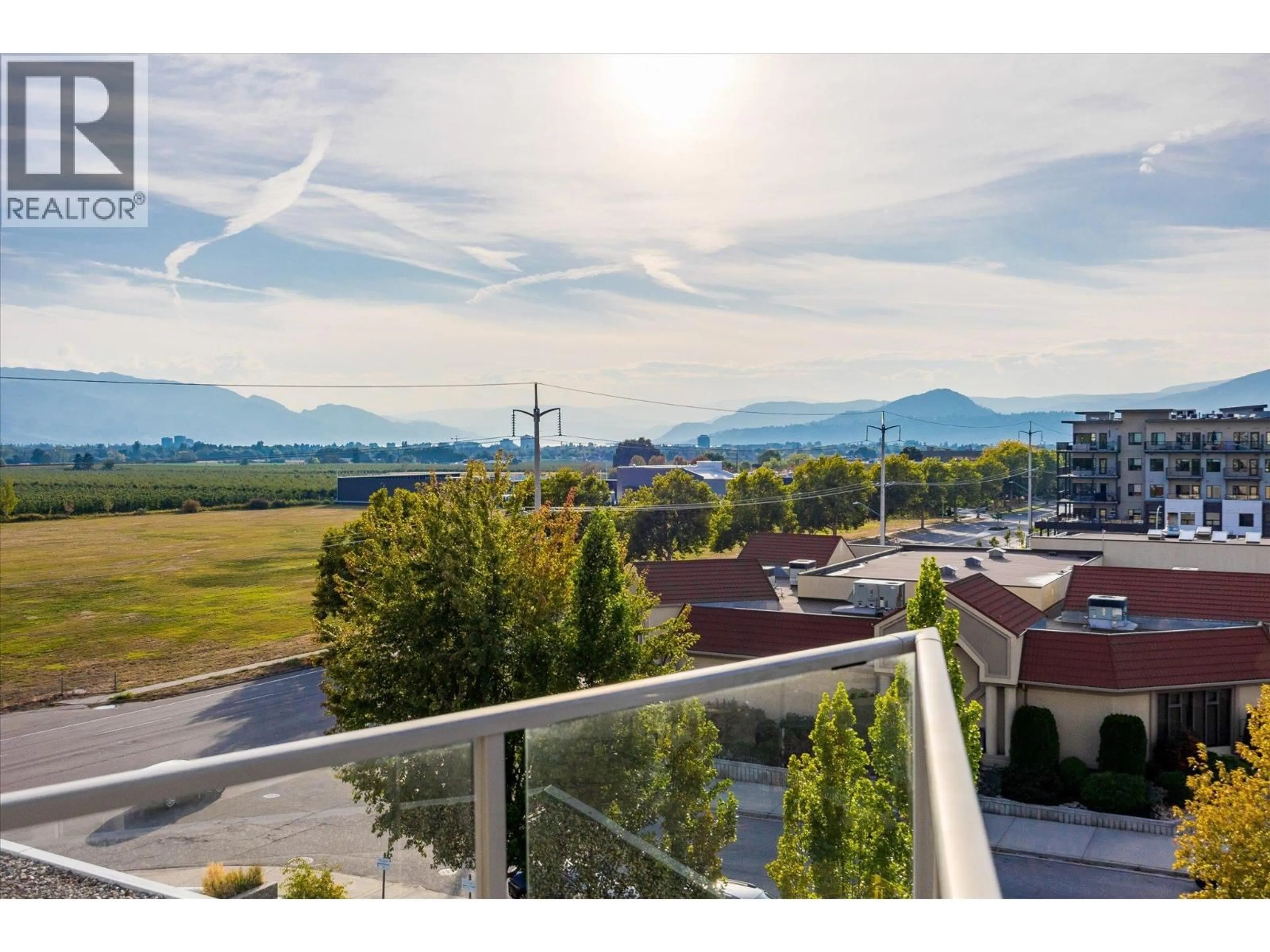 A pic from outside/outdoor area/front of a property/back of a property/a pic from drone, mountain view for 401 - 2040 SPRINGFIELD ROAD, Kelowna British Columbia V1Y9N7