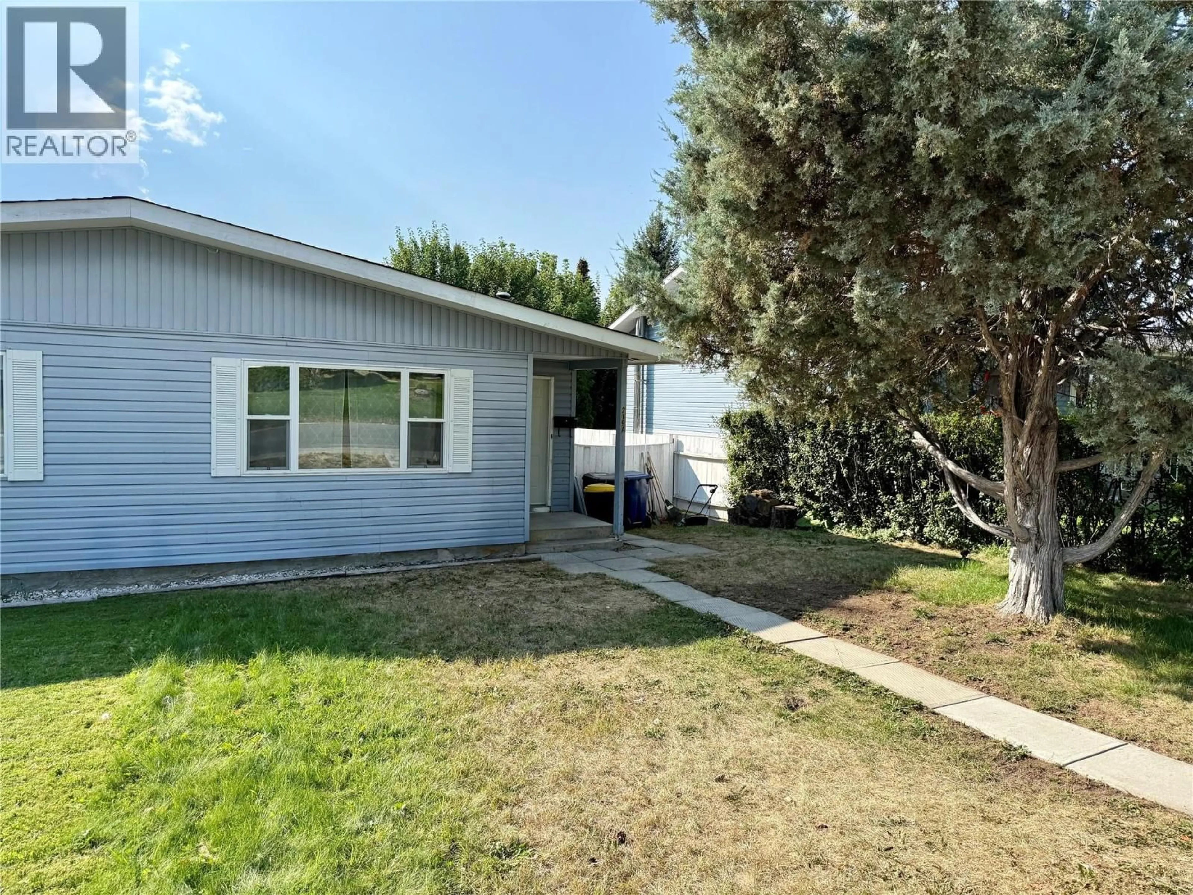 Home with vinyl exterior material, street for A - 219 26TH  S AVENUE, Cranbrook British Columbia V1C3J2