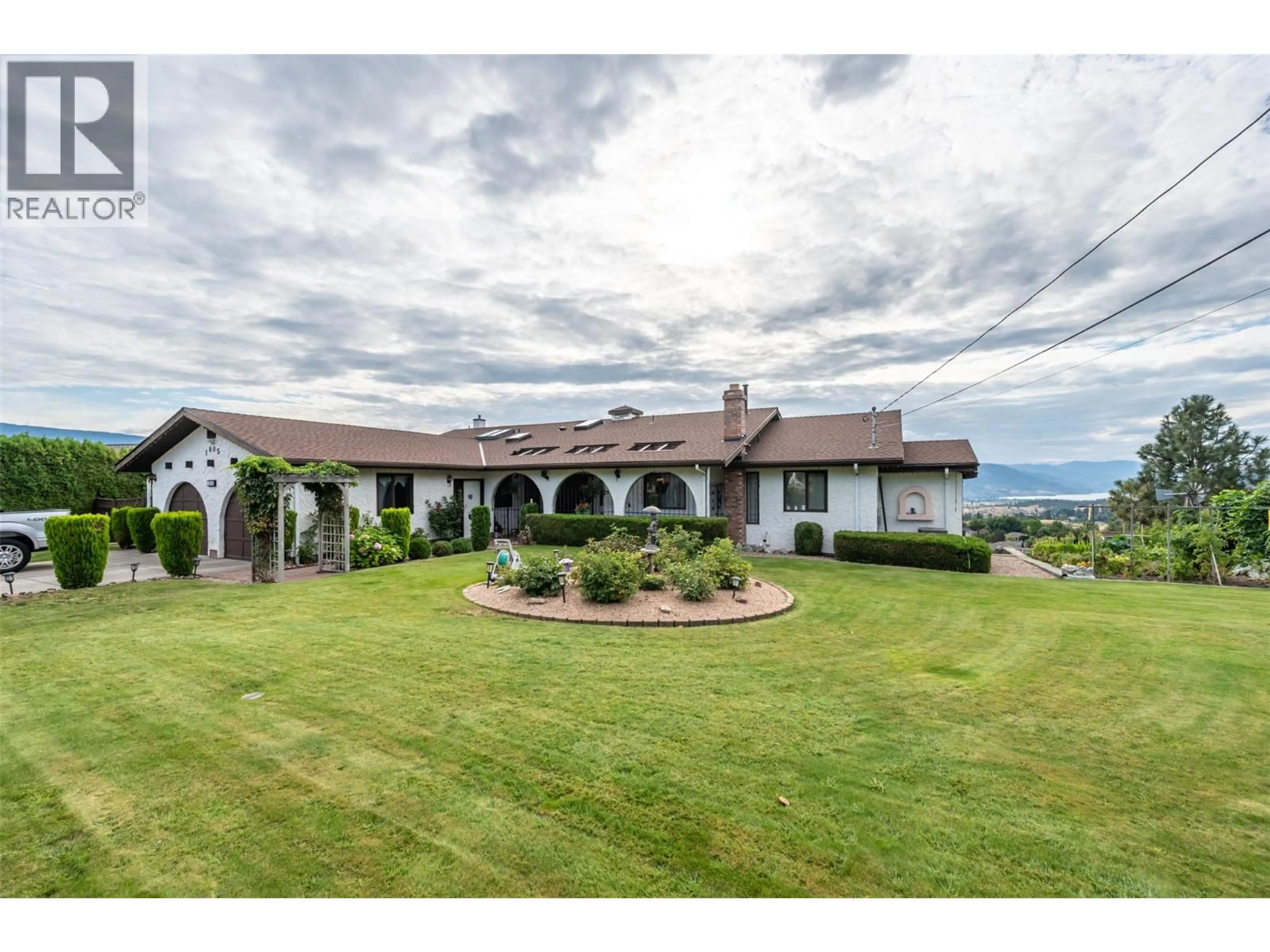 A pic from outside/outdoor area/front of a property/back of a property/a pic from drone, mountain view for 1805 ESTATES PLACE, Penticton British Columbia V2A8Y9