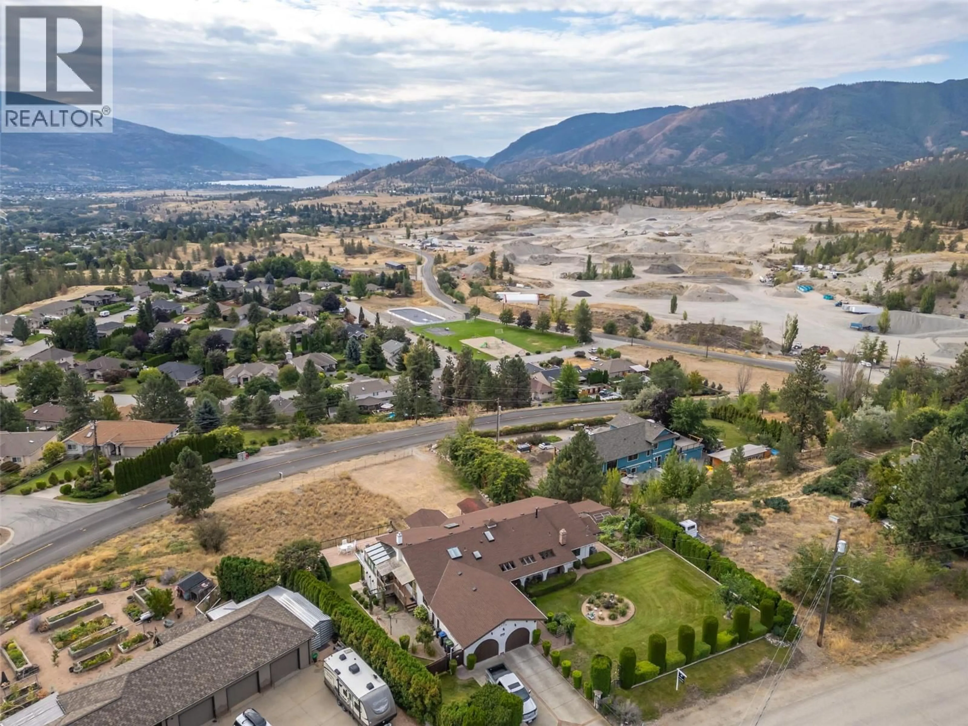 A pic from outside/outdoor area/front of a property/back of a property/a pic from drone, mountain view for 1805 ESTATES PLACE, Penticton British Columbia V2A8Y9