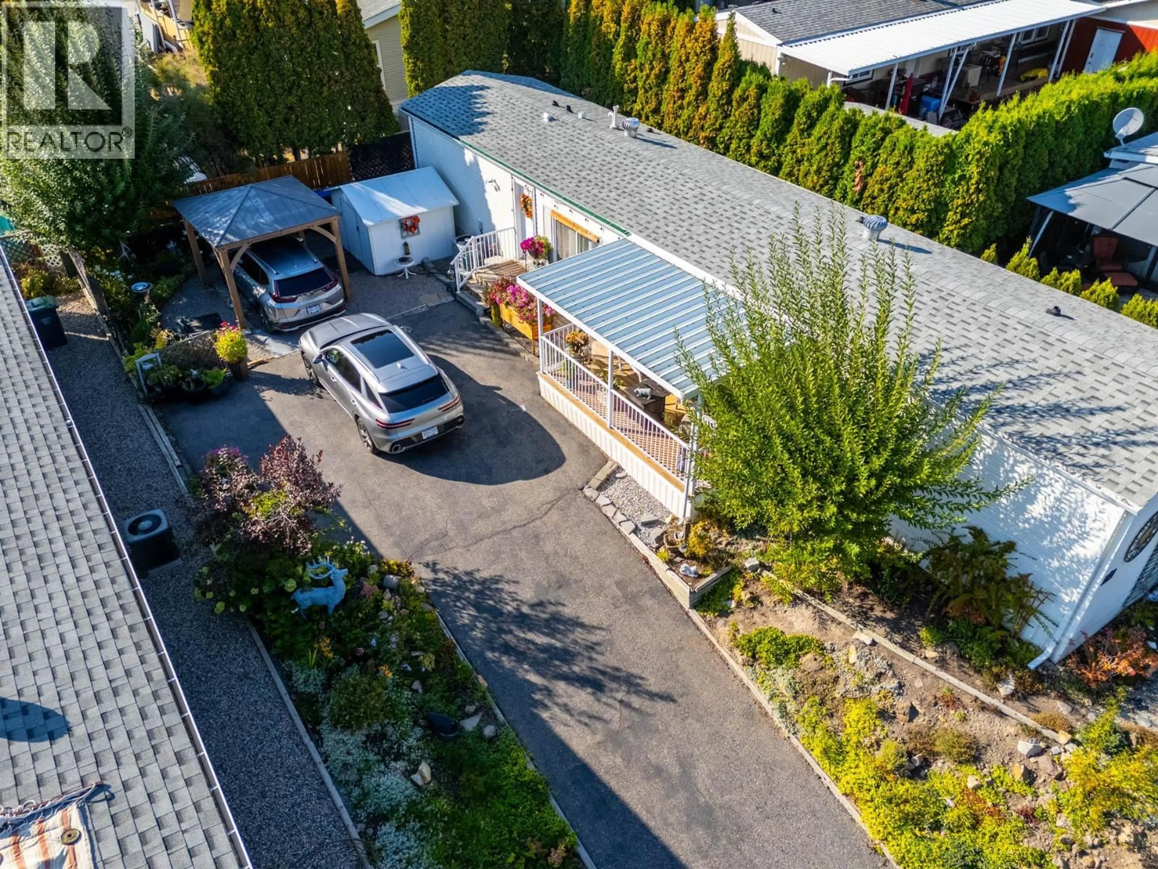 A pic from outside/outdoor area/front of a property/back of a property/a pic from drone, street for 34 - 1750 LENZ ROAD, West Kelowna British Columbia V1Z3N1