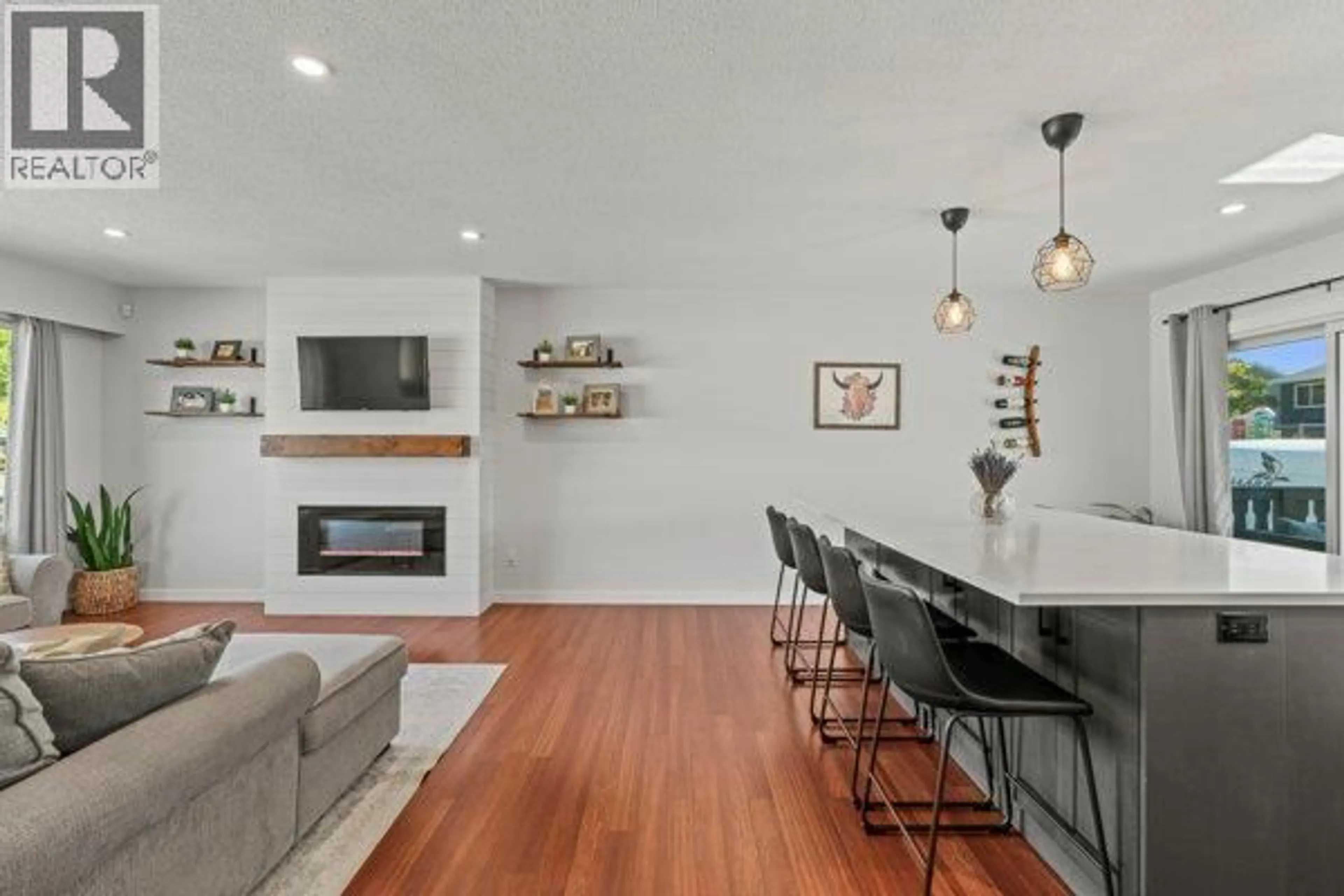 Open concept kitchen, wood/laminate floor for 4500 17 STREET, Vernon British Columbia V1T3Z3