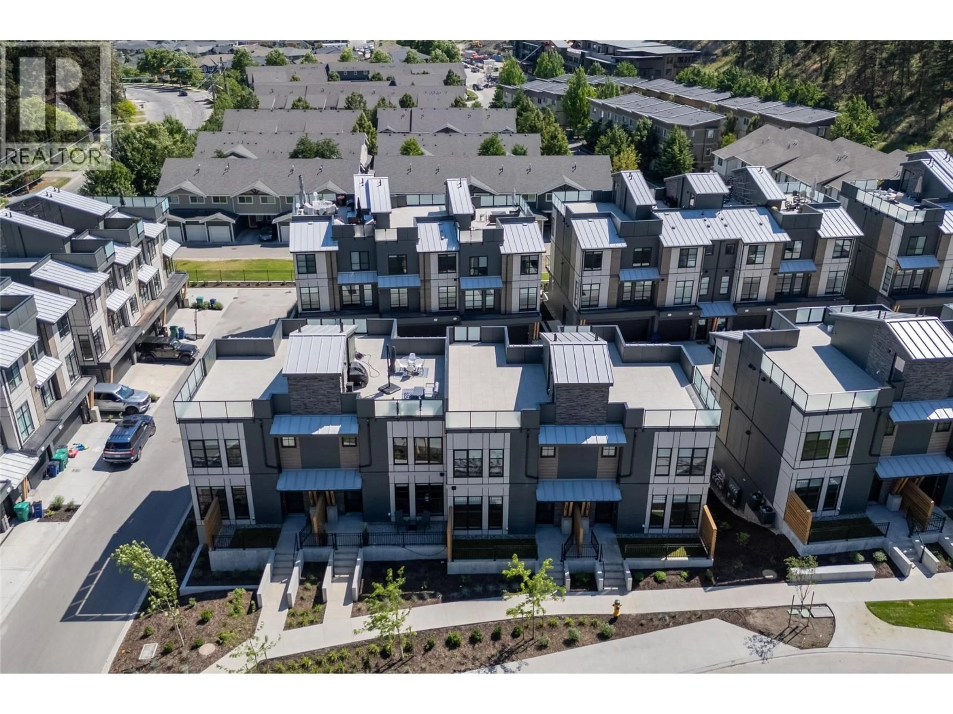 A pic from outside/outdoor area/front of a property/back of a property/a pic from drone, unknown for 133 - 1455 CARA GLEN COURT, Kelowna British Columbia V1V3B8