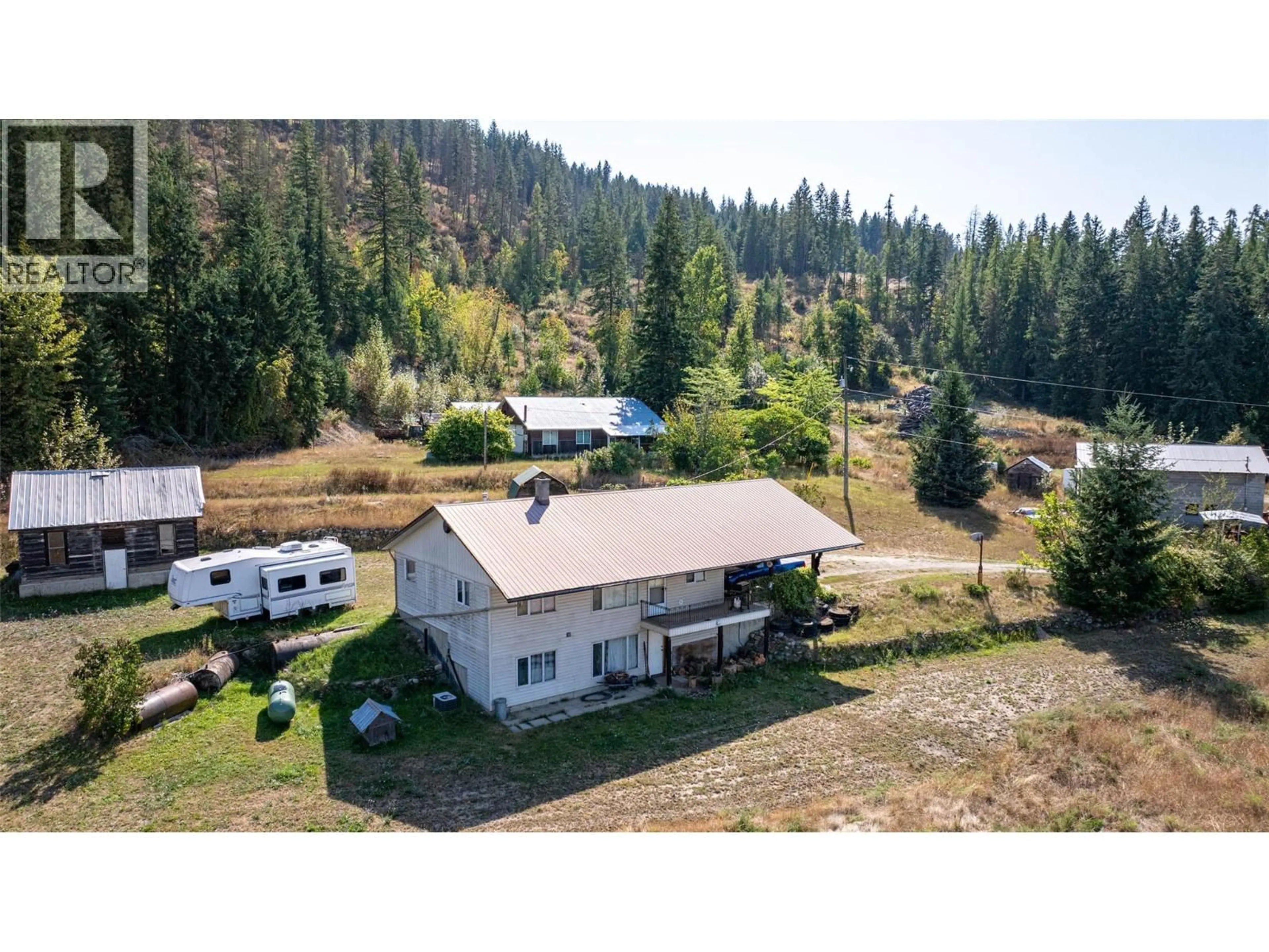 A pic from outside/outdoor area/front of a property/back of a property/a pic from drone, mountain view for 4596 BACK ENDERBY ROAD, Spallumcheen British Columbia V0E1B8
