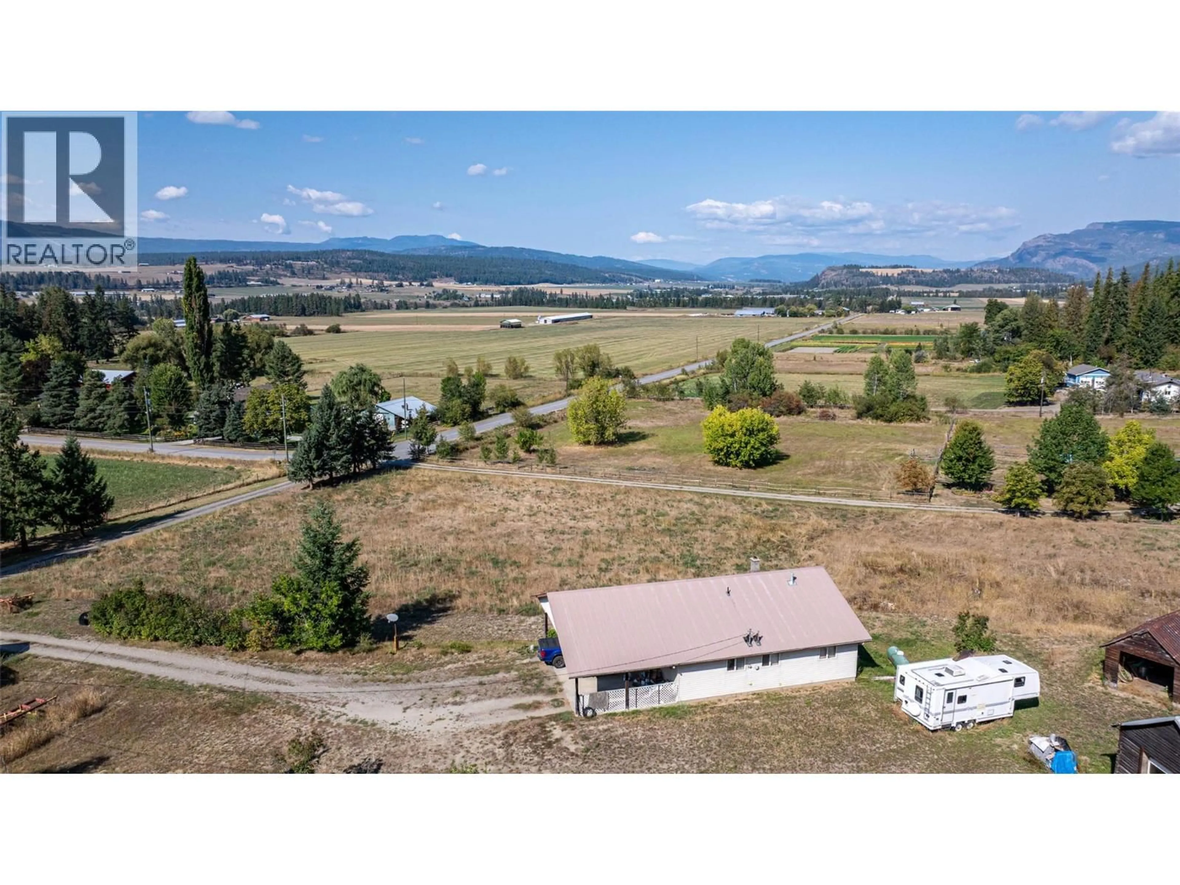 A pic from outside/outdoor area/front of a property/back of a property/a pic from drone, mountain view for 4596 BACK ENDERBY ROAD, Spallumcheen British Columbia V0E1B8