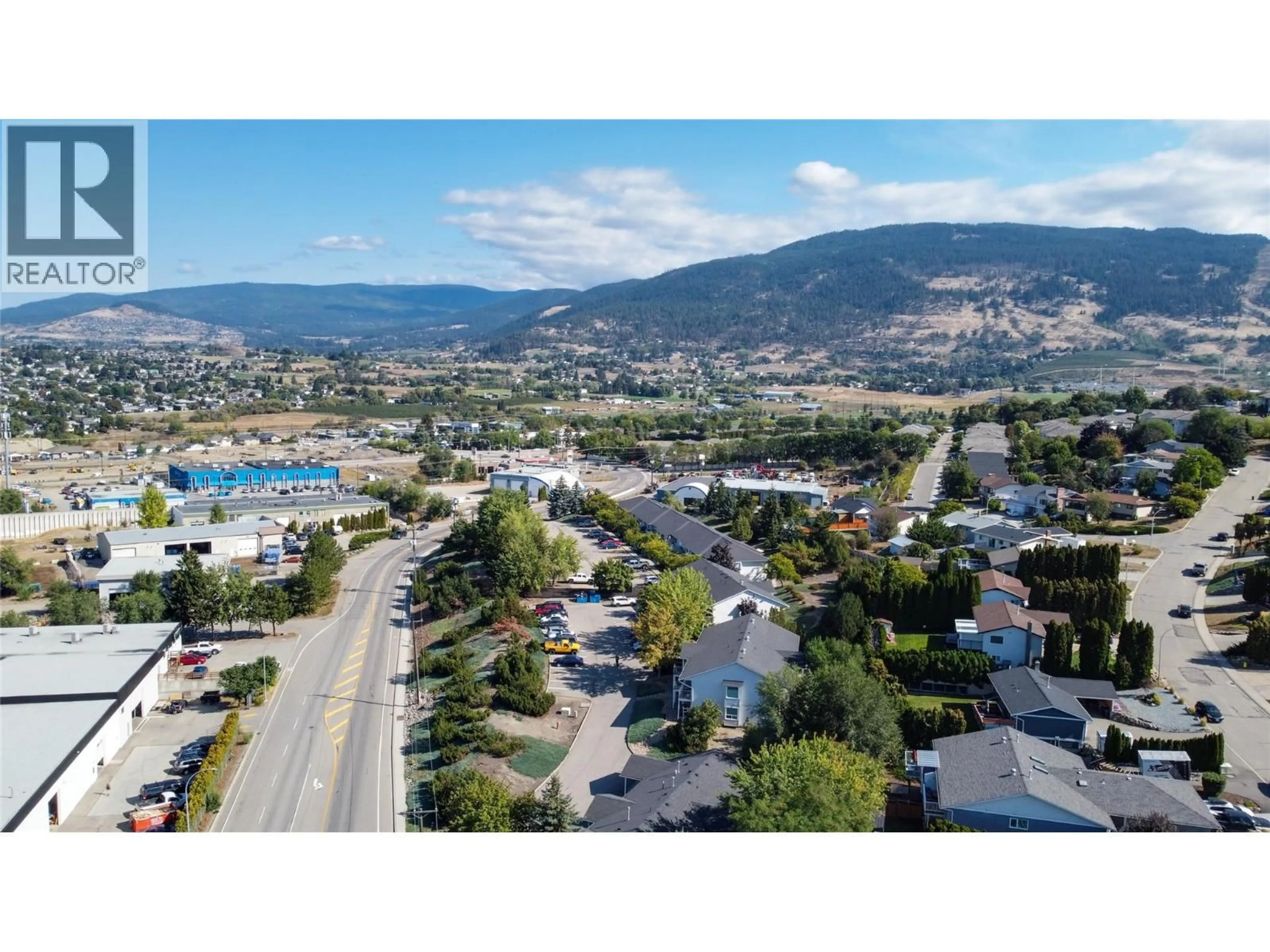 A pic from outside/outdoor area/front of a property/back of a property/a pic from drone, mountain view for 105 - 1041 MIDDLETON WAY, Vernon British Columbia V1B2N3