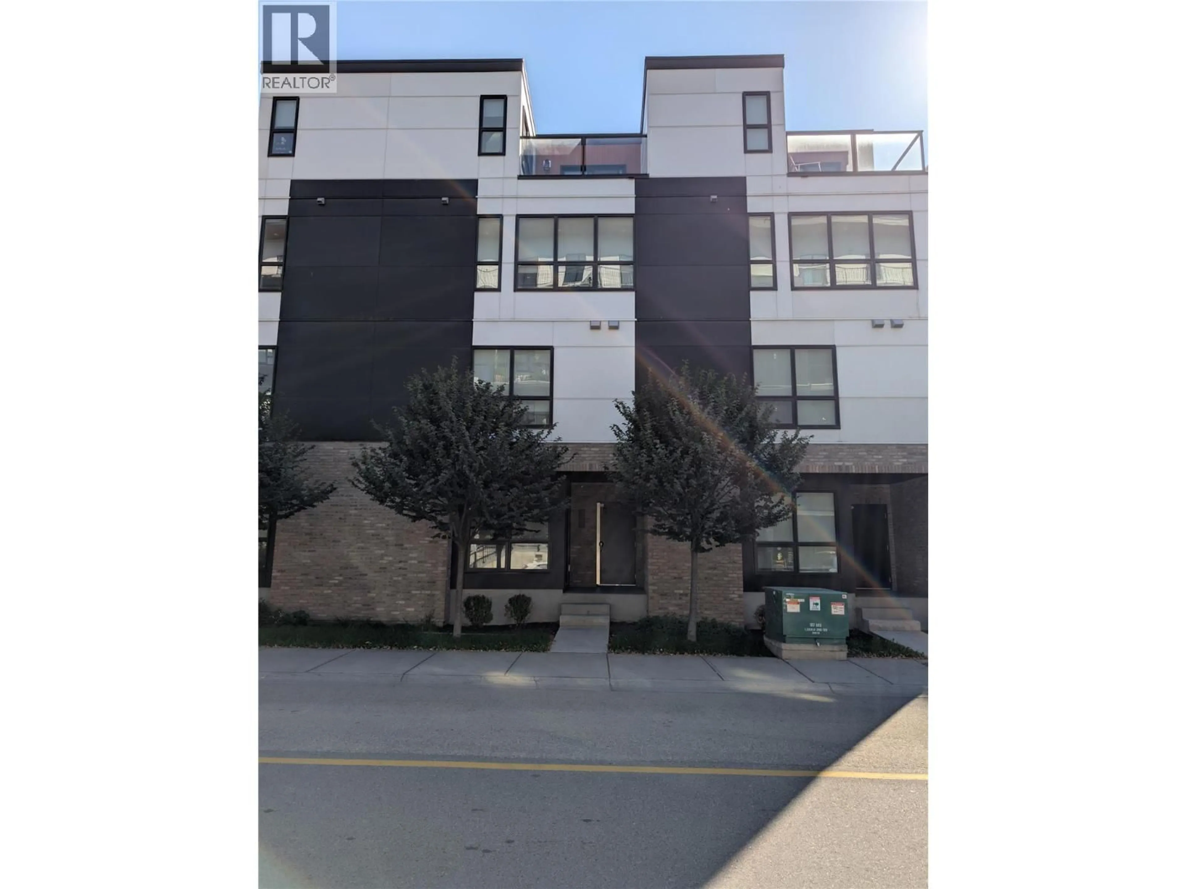 A pic from outside/outdoor area/front of a property/back of a property/a pic from drone, street for 102 - 1308 RICHTER STREET, Kelowna British Columbia V1Y2L3