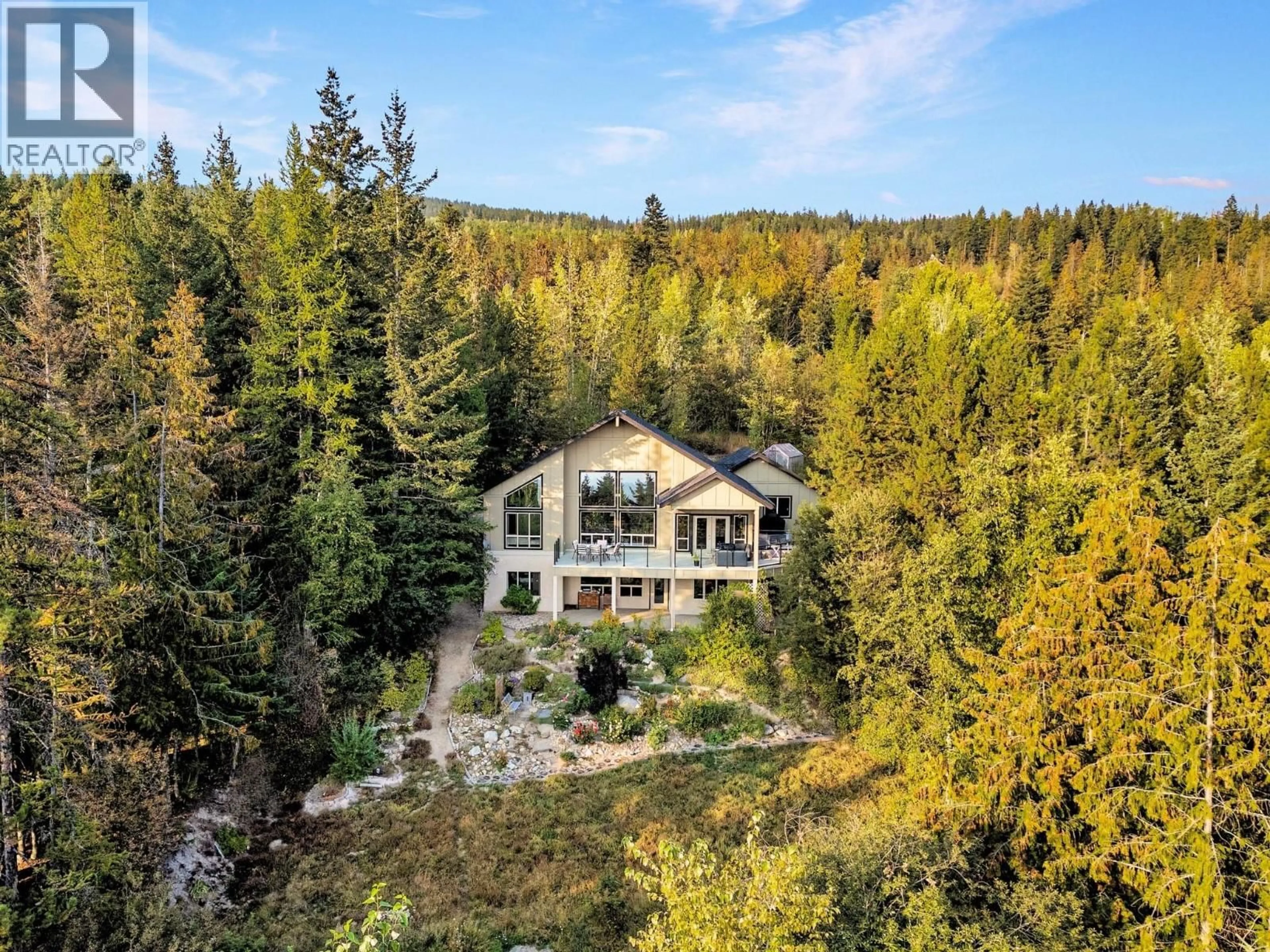 A pic from outside/outdoor area/front of a property/back of a property/a pic from drone, forest/trees view for 8130 JACKPINE ROAD, Vernon British Columbia V1B3M9