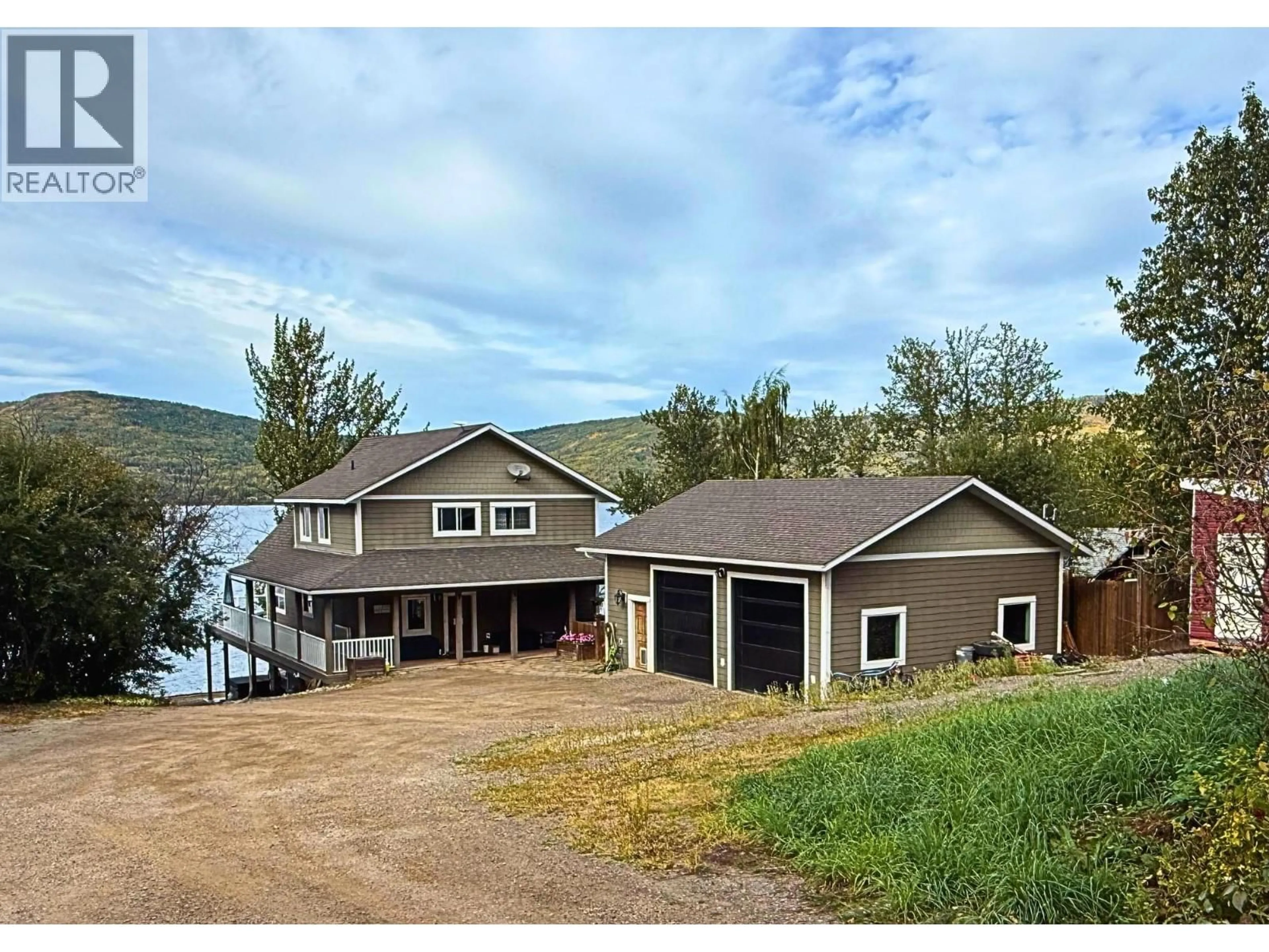 A pic from outside/outdoor area/front of a property/back of a property/a pic from drone, water/lake/river/ocean view for 6986 SOUTH MOBERLY LAKE ROAD, Moberly Lake British Columbia V0C1X0