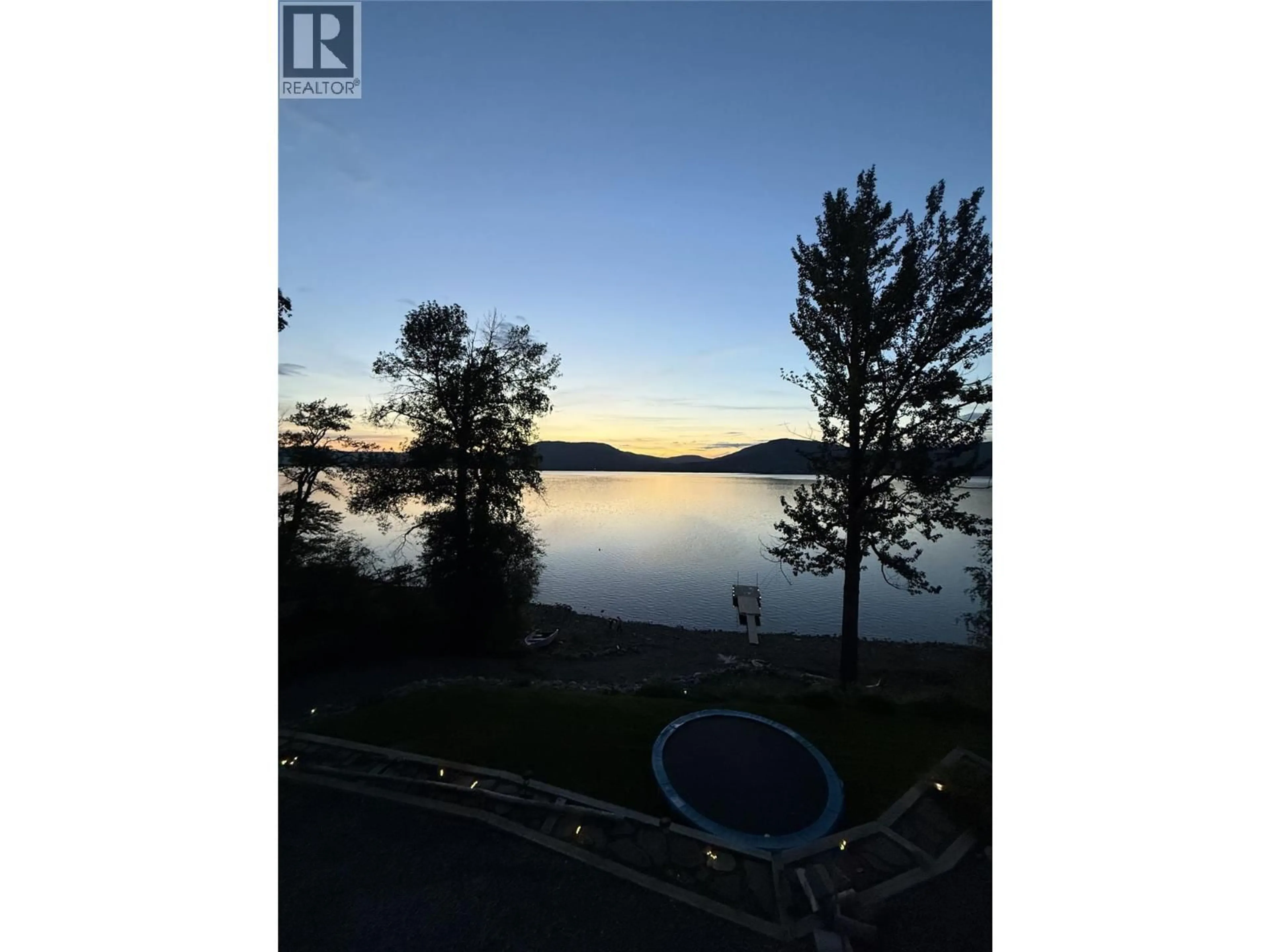 A pic from outside/outdoor area/front of a property/back of a property/a pic from drone, water/lake/river/ocean view for 6986 SOUTH MOBERLY LAKE ROAD, Moberly Lake British Columbia V0C1X0